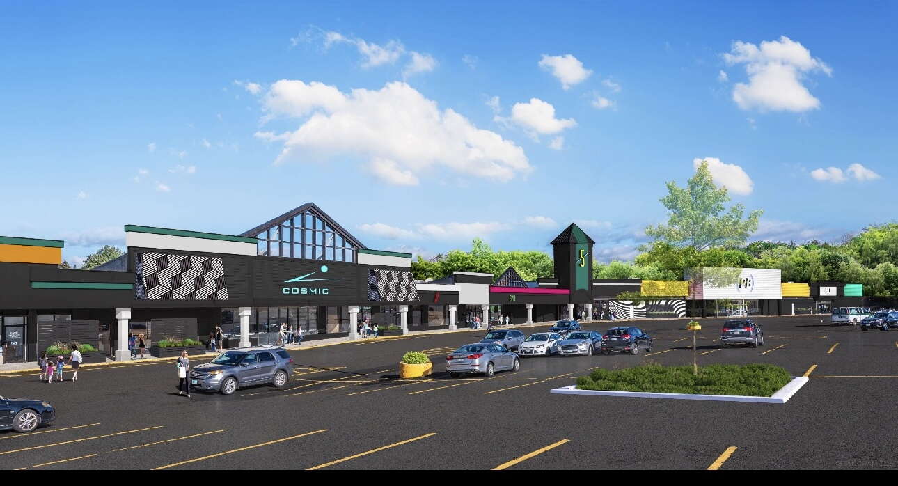 rendering of long low building and parking lot and cars