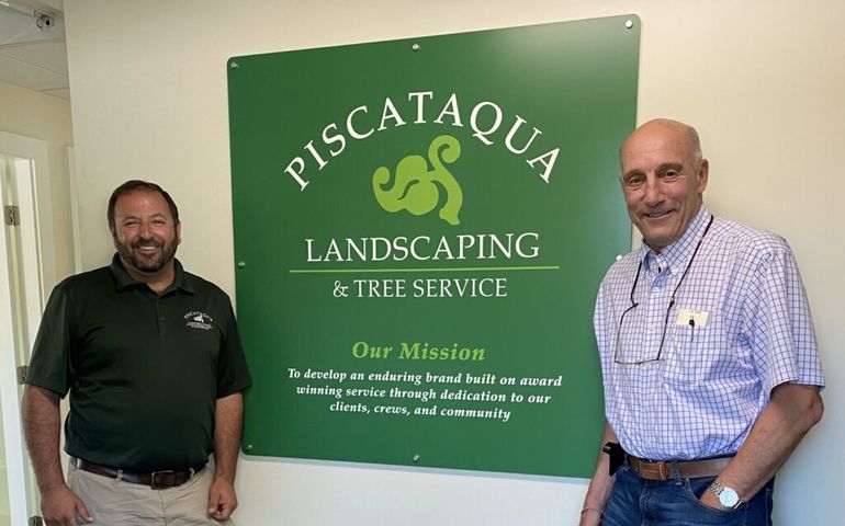 Justin Gamester, President & CEO of Piscataqua Landscaping & Tree Service, pictured here with retiring Mick Sheffield, founder of Labrie Associates celebrating the recent sale.