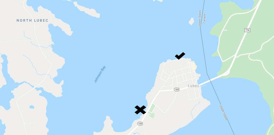 A map showing Lubec, Maine, with an X where a new harbor will be built and a checkmark where the current commercial fishing wharf is.