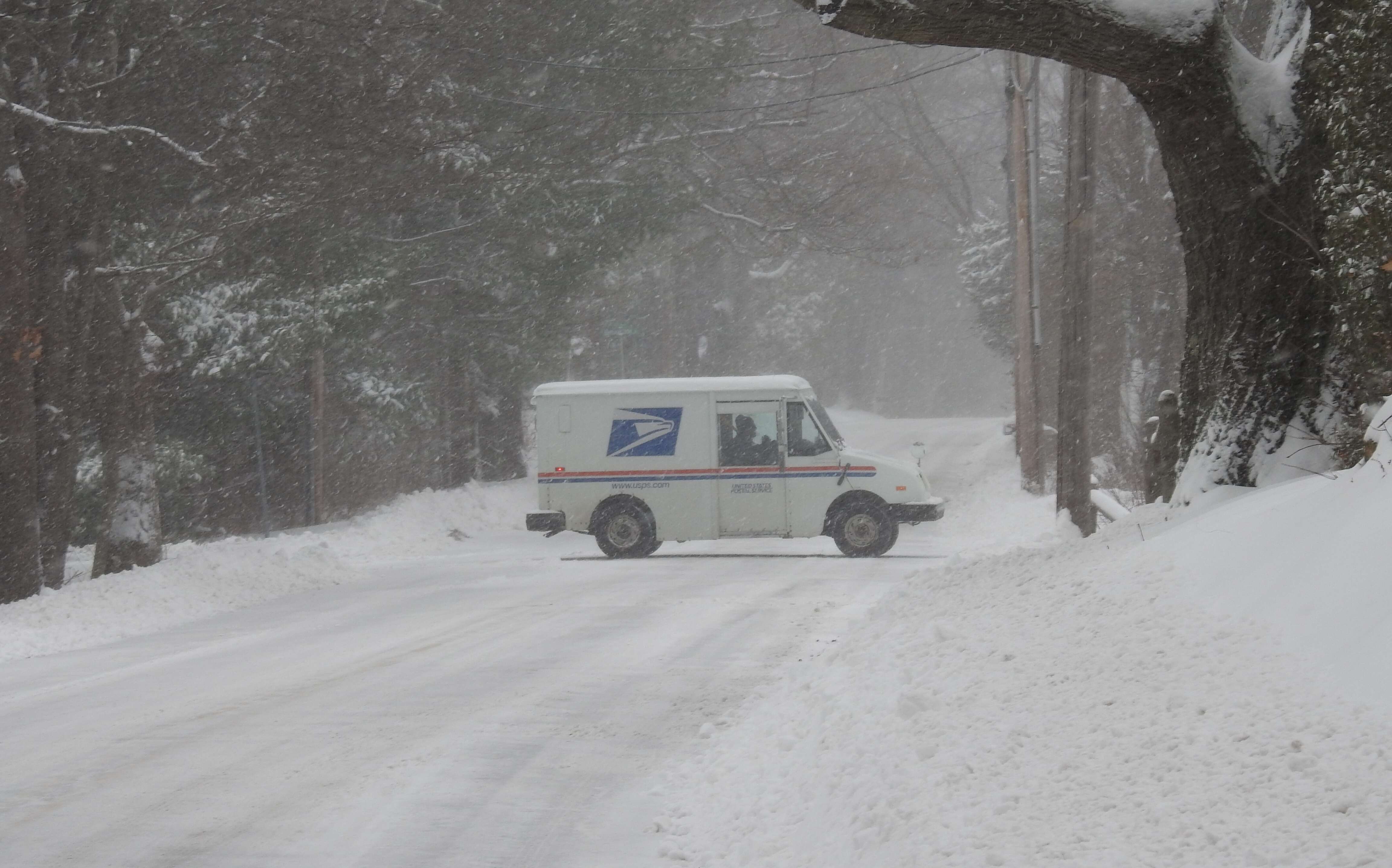 mail truck in snow