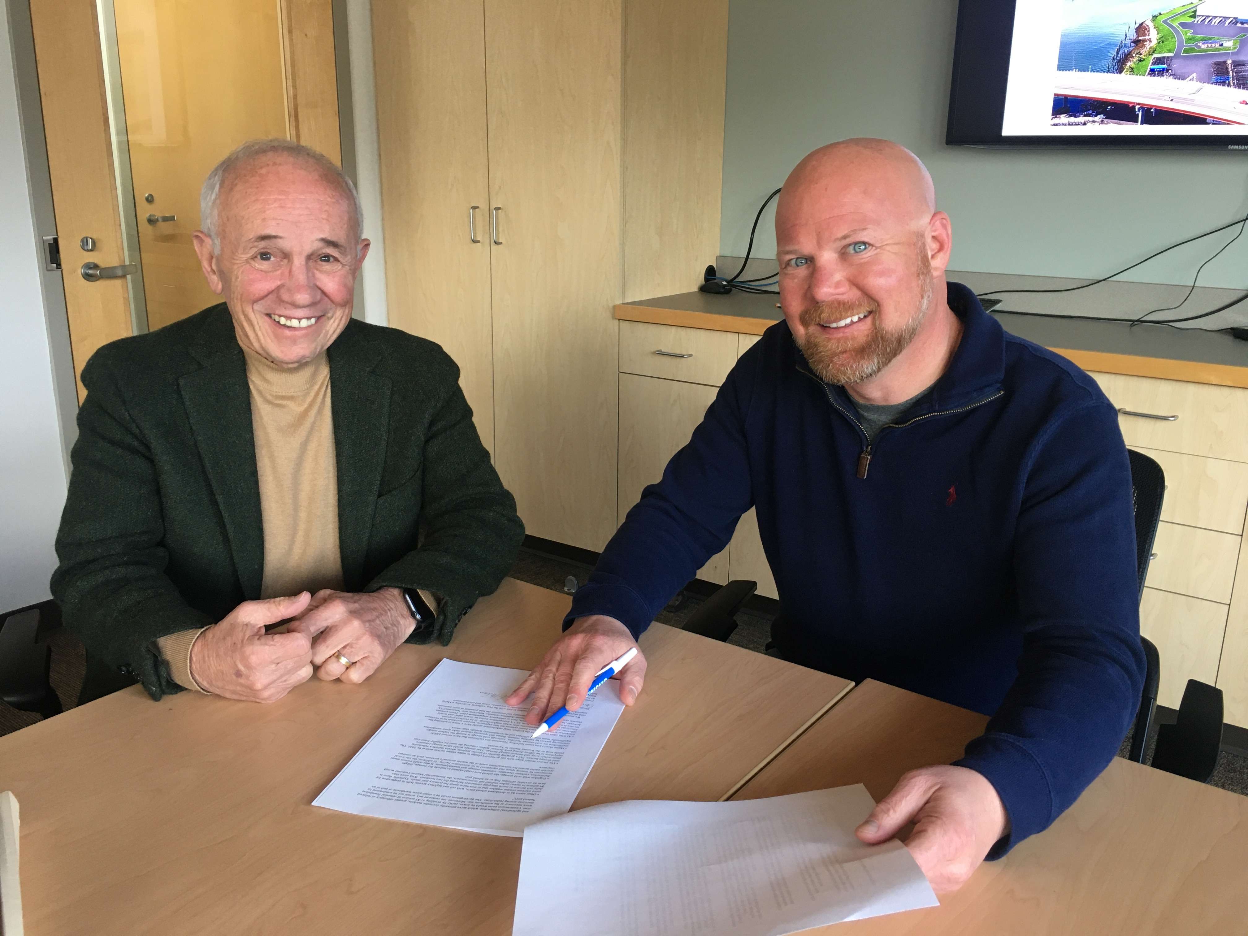 George Campbell and Jonathan Nass reviewing papers for a new Portland cold storage facility.