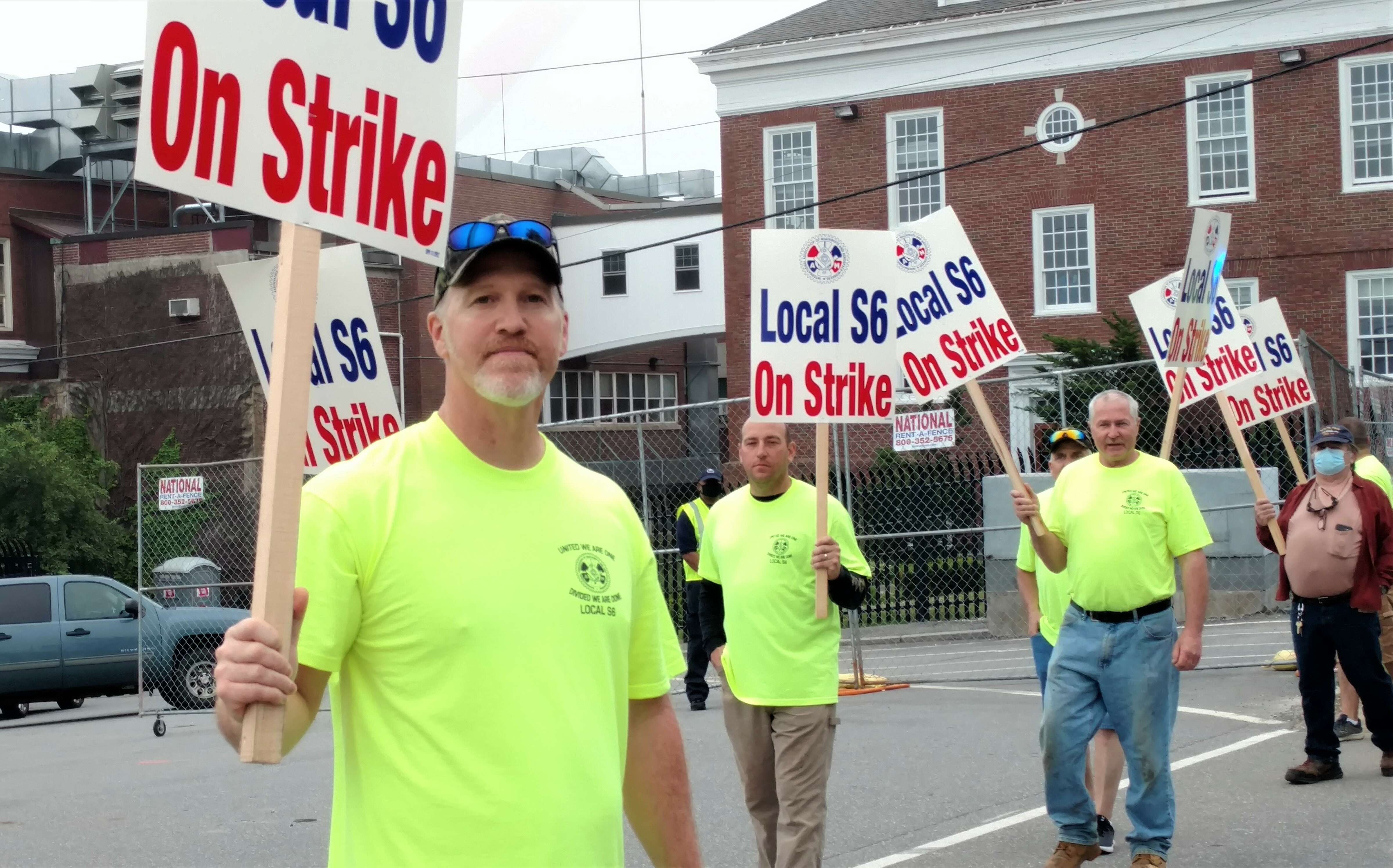 man with picket sign