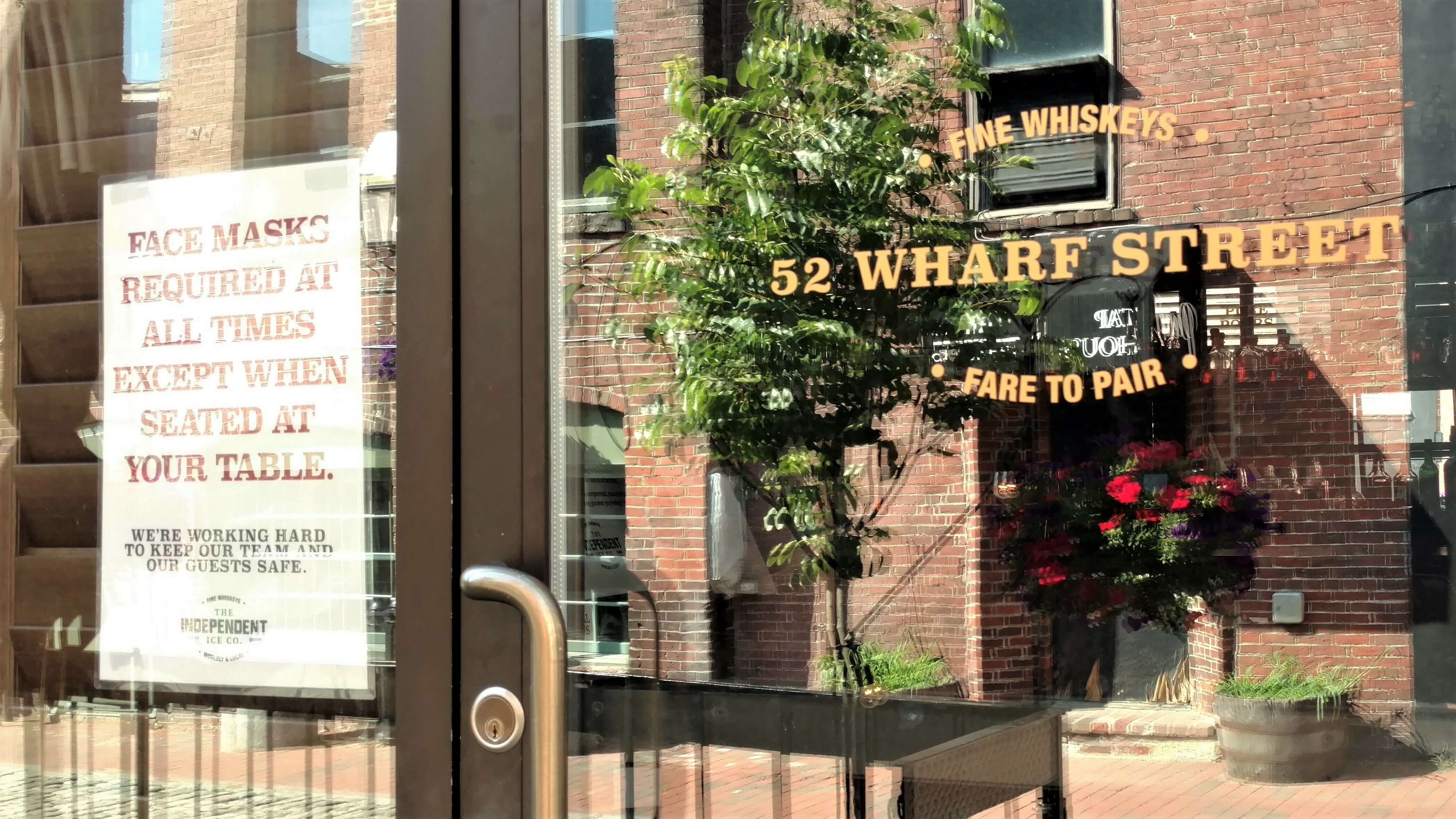 close-up of glass door and sign