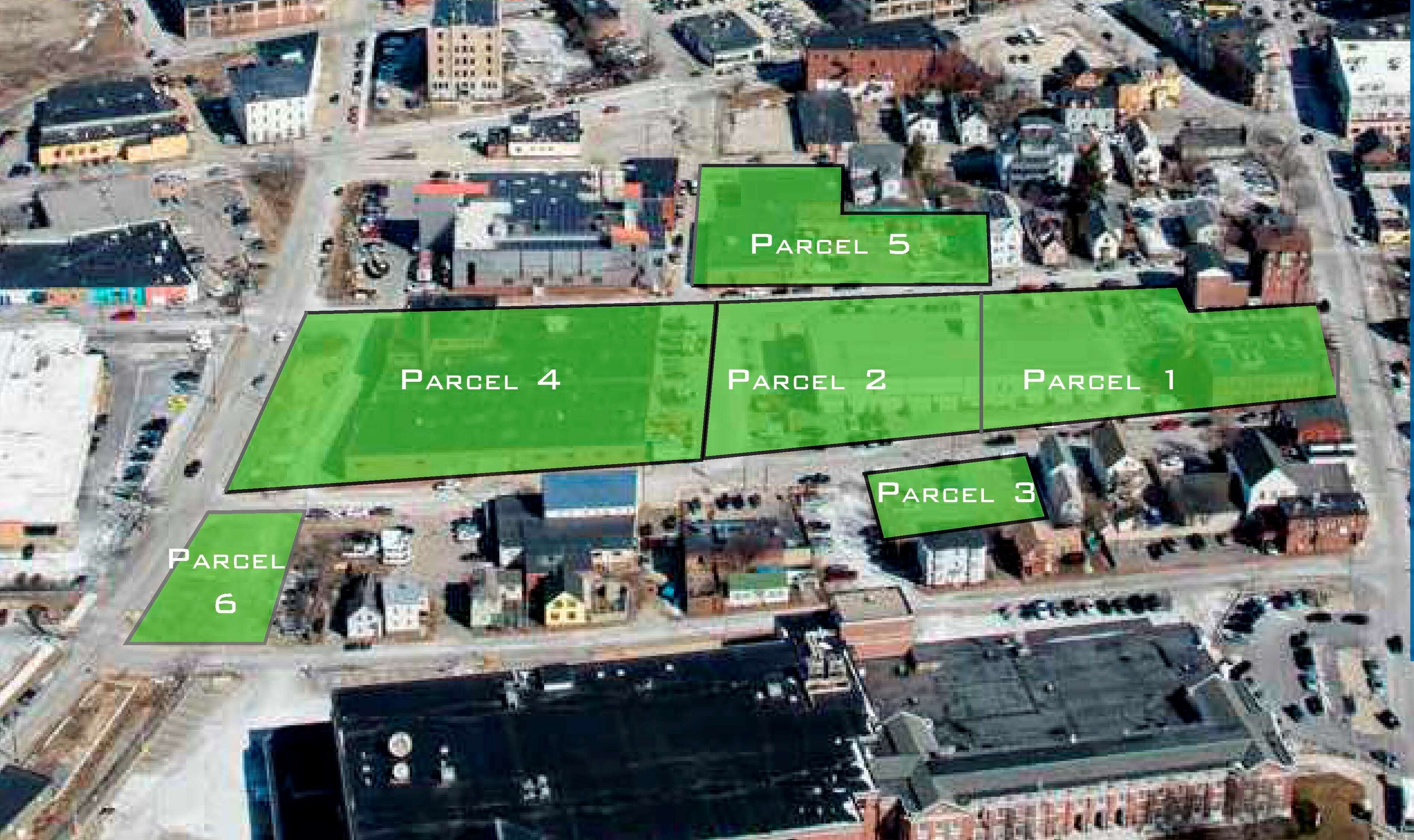 an aerial map of an industrial looking area of a city with green overlays on five parcels, numbered 1 through 5