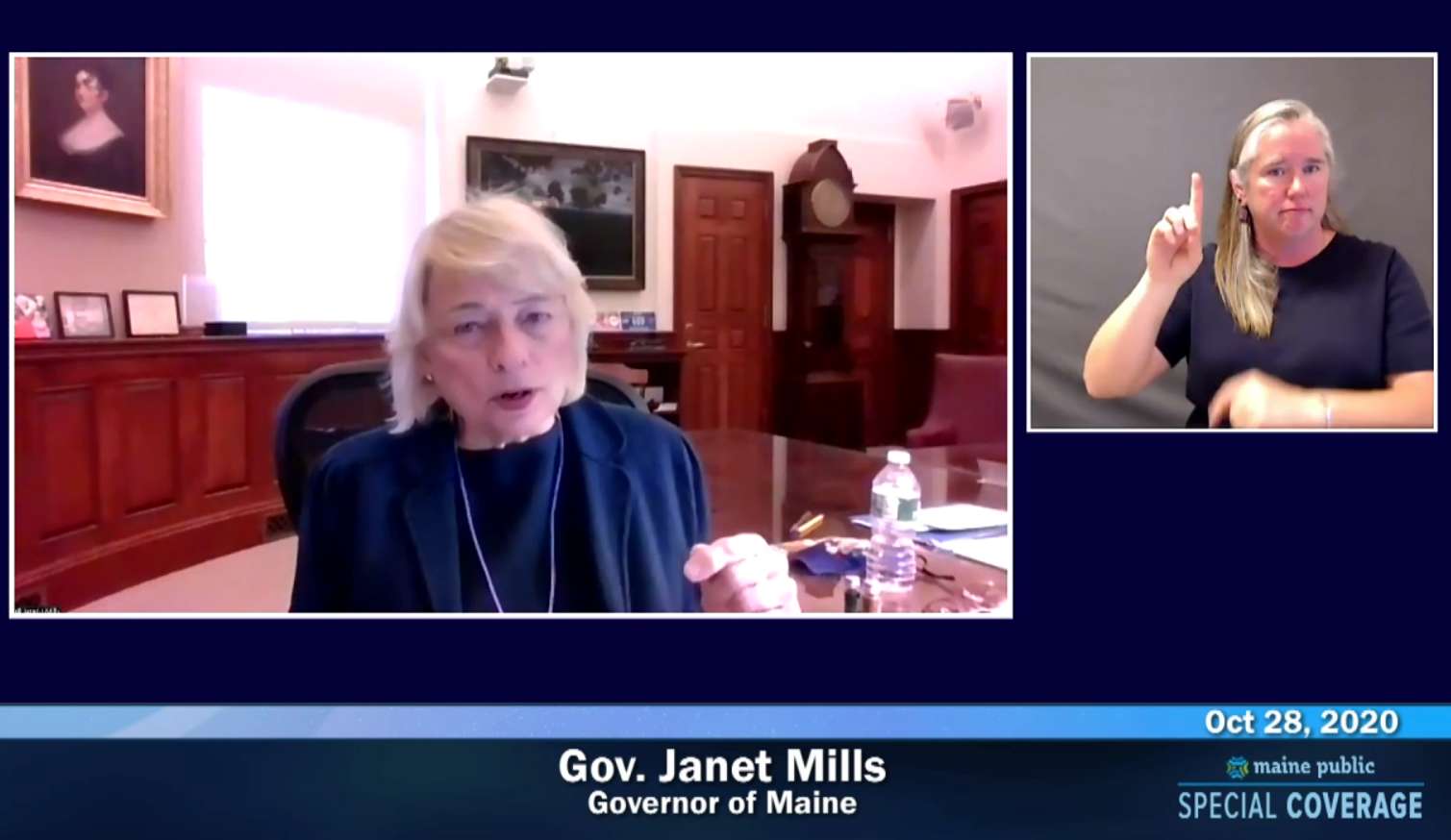 A screen image of a woman talking, with a sign language interpreter, under the woman it sasy gov janet mills governor of maine