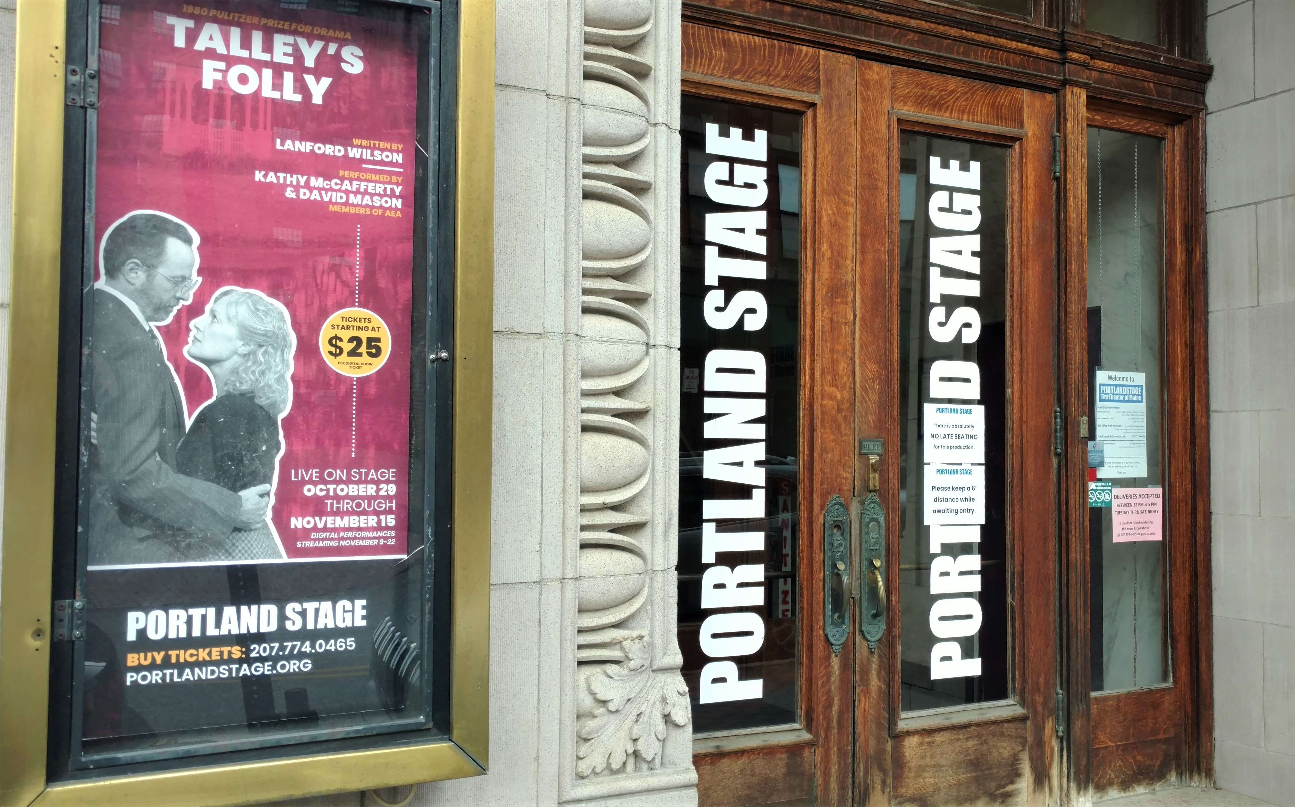 exterior doors with "portland stage" in bold letter, next to sign reading "talley's folly"