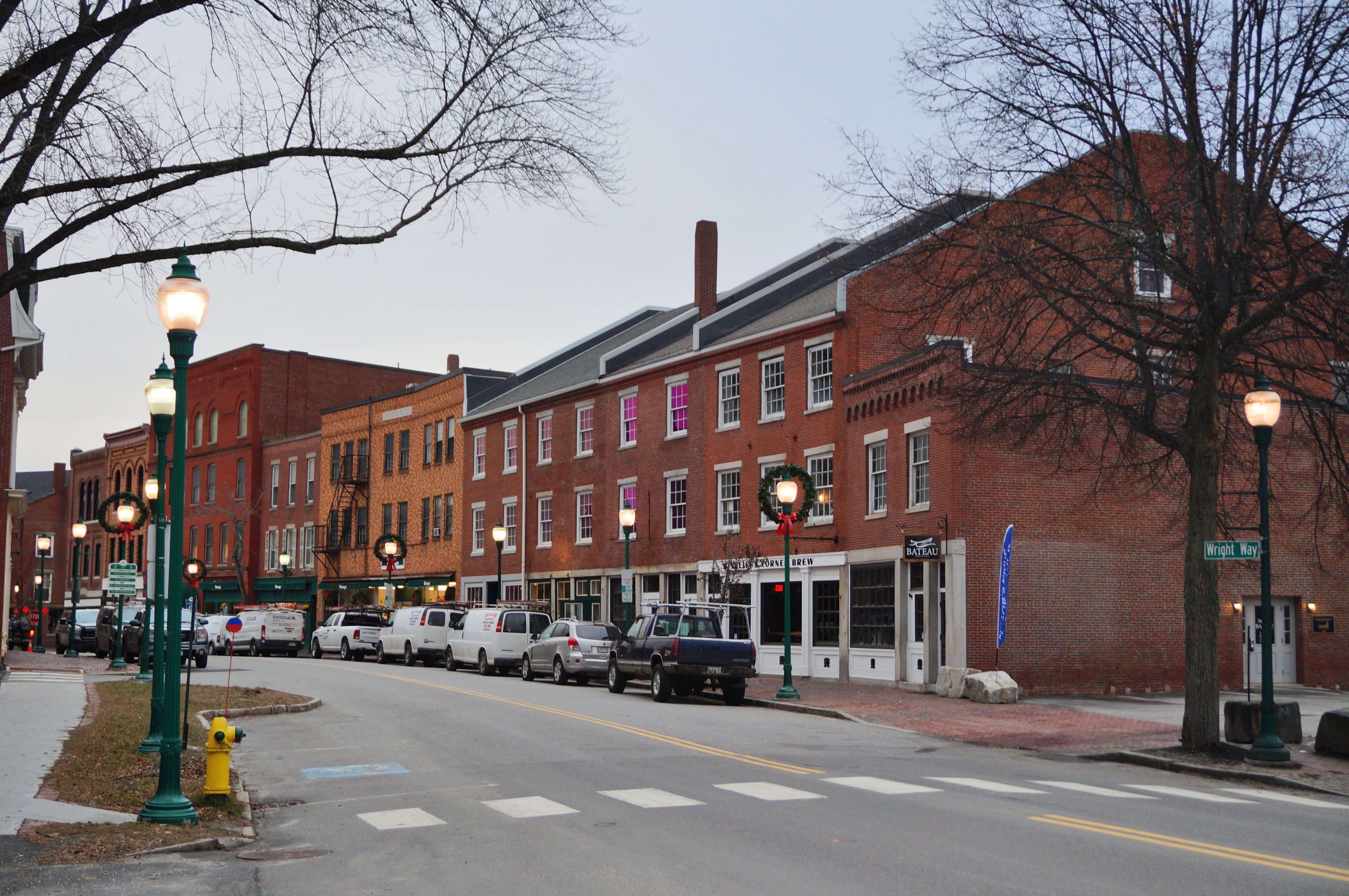 A downtown street with old three-story brick buildings