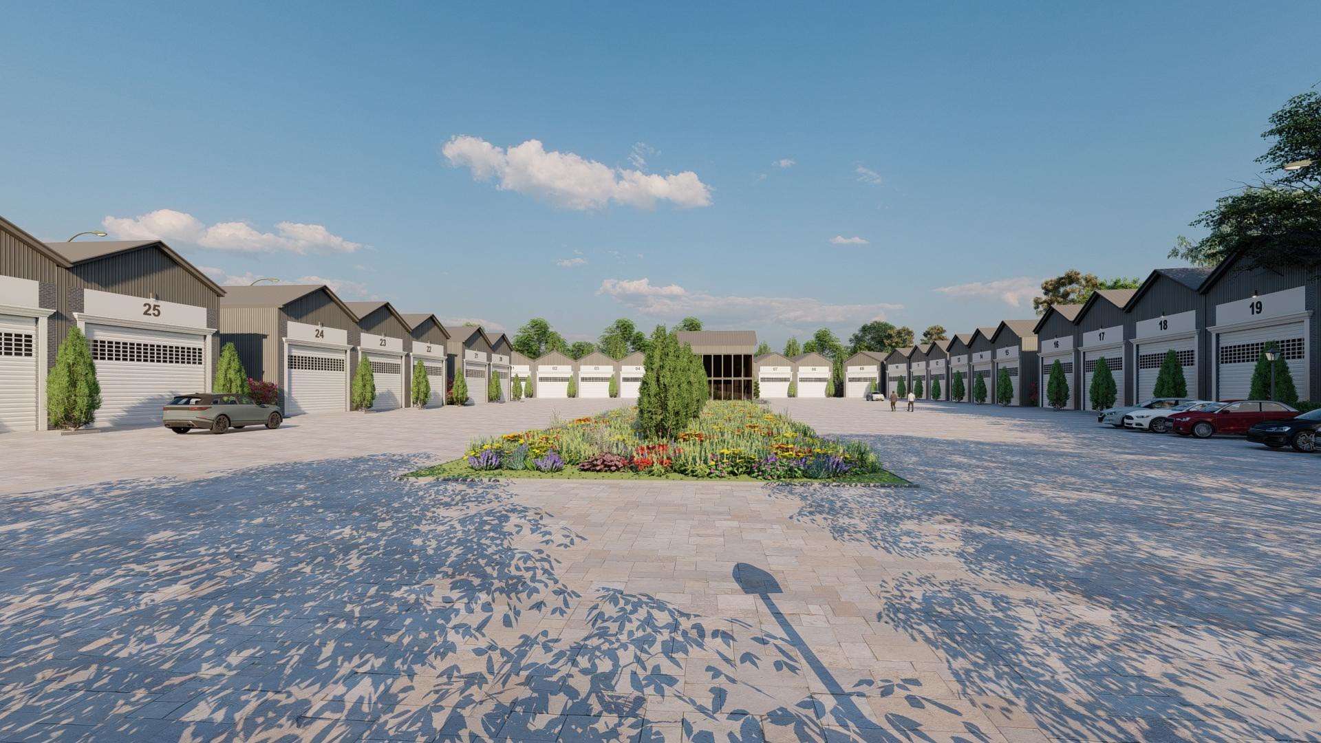 a grouping of large garages around a paved landscaped courtyard