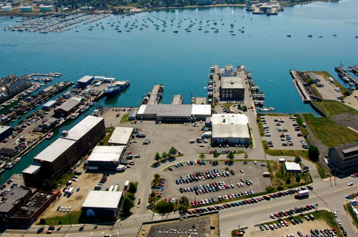 aerial of wharf and buildings and cars