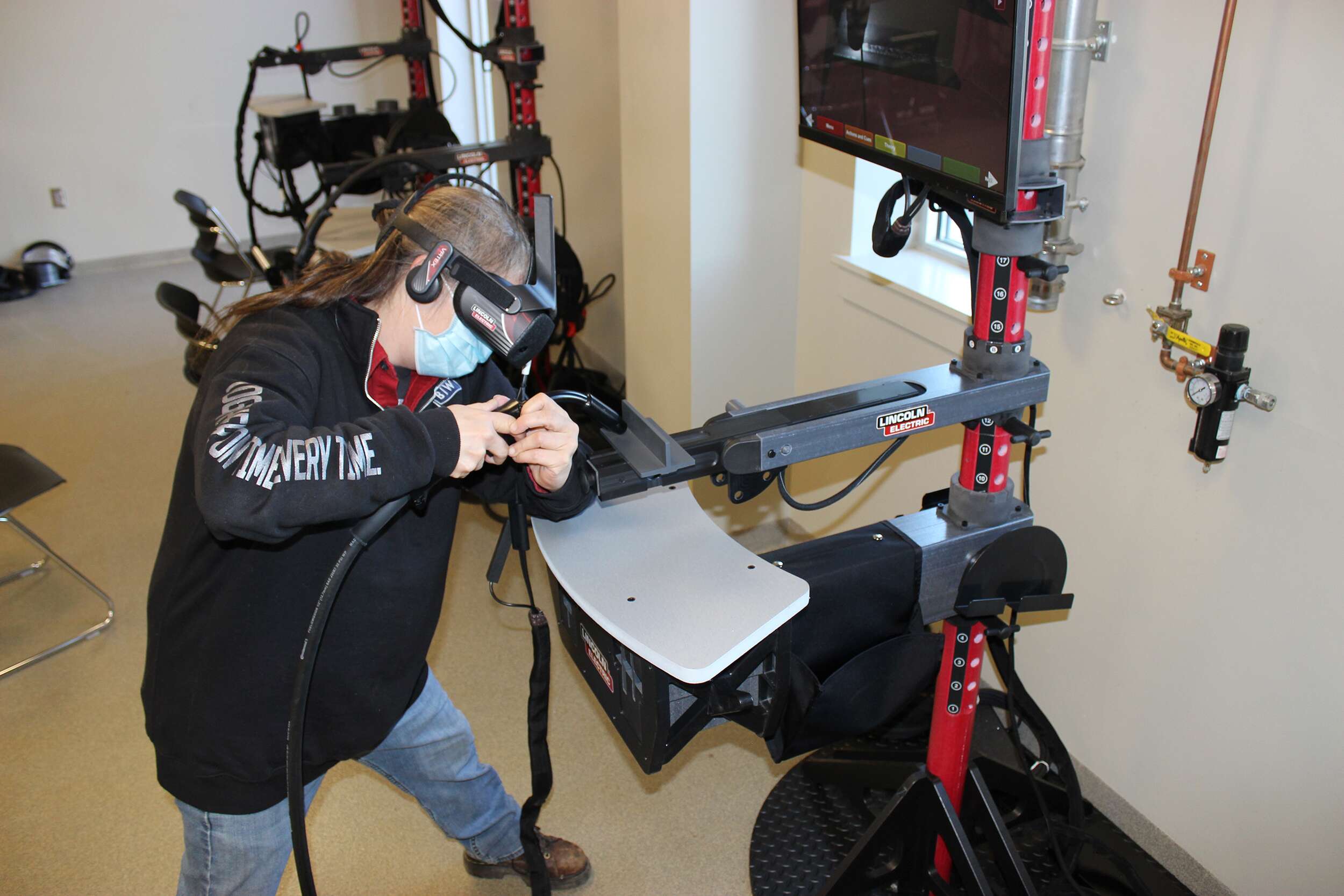 person in goggles welding