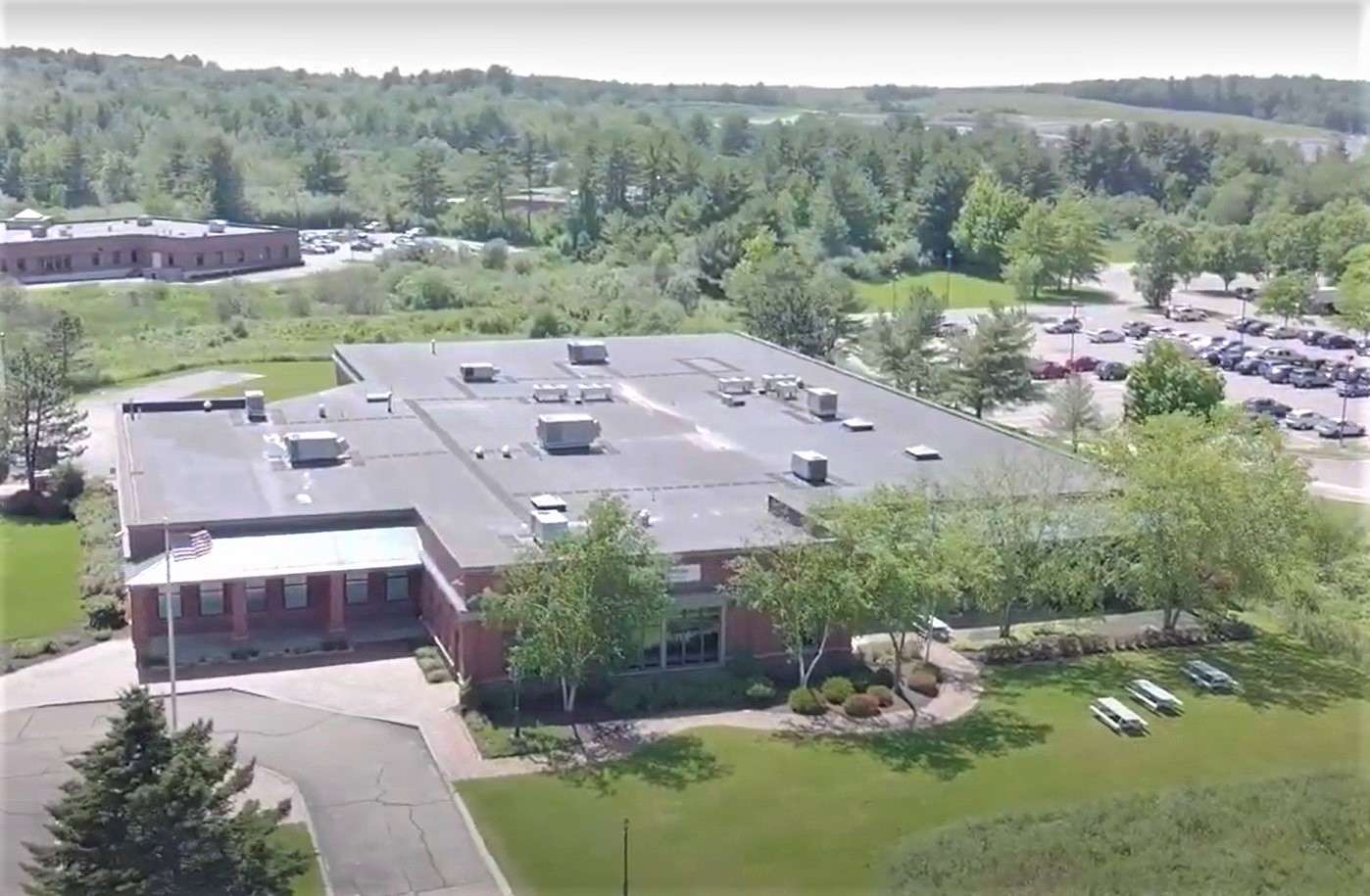 aerial view of one-story brick building