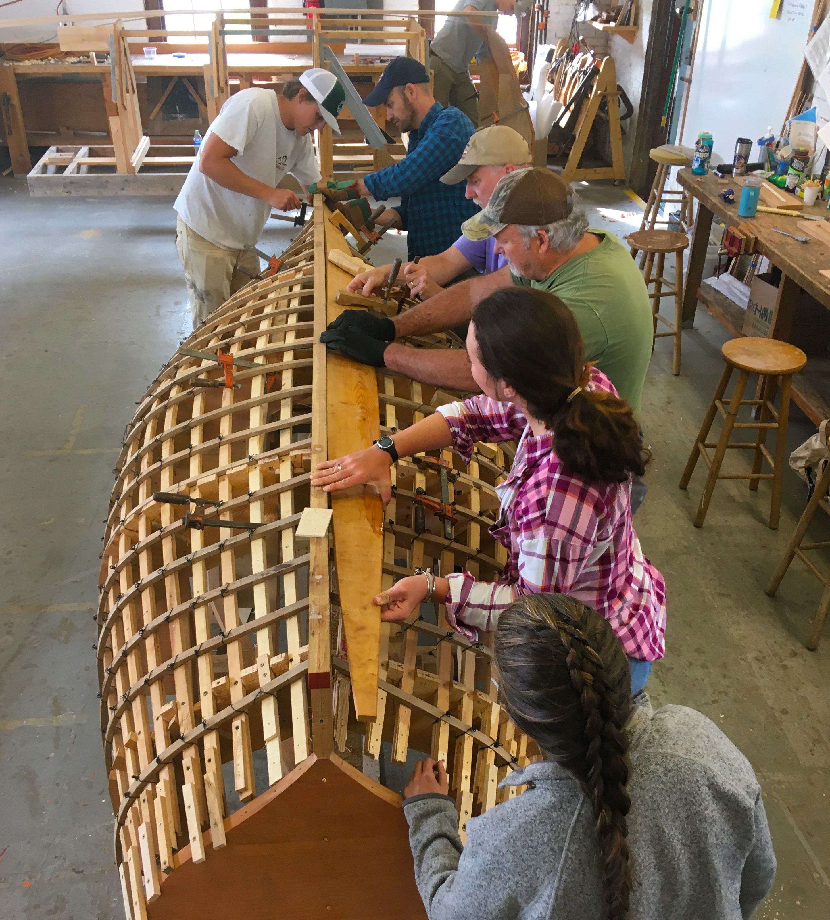 people building boat