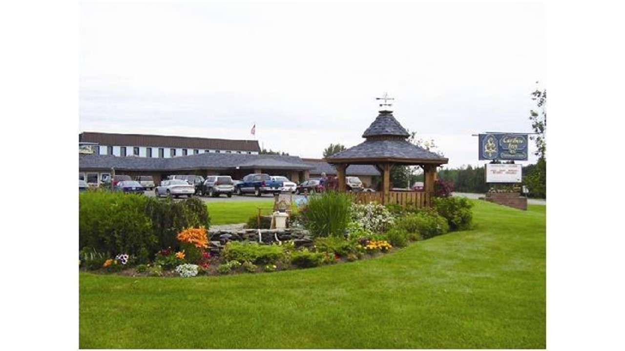 hotel and lawn and pergola