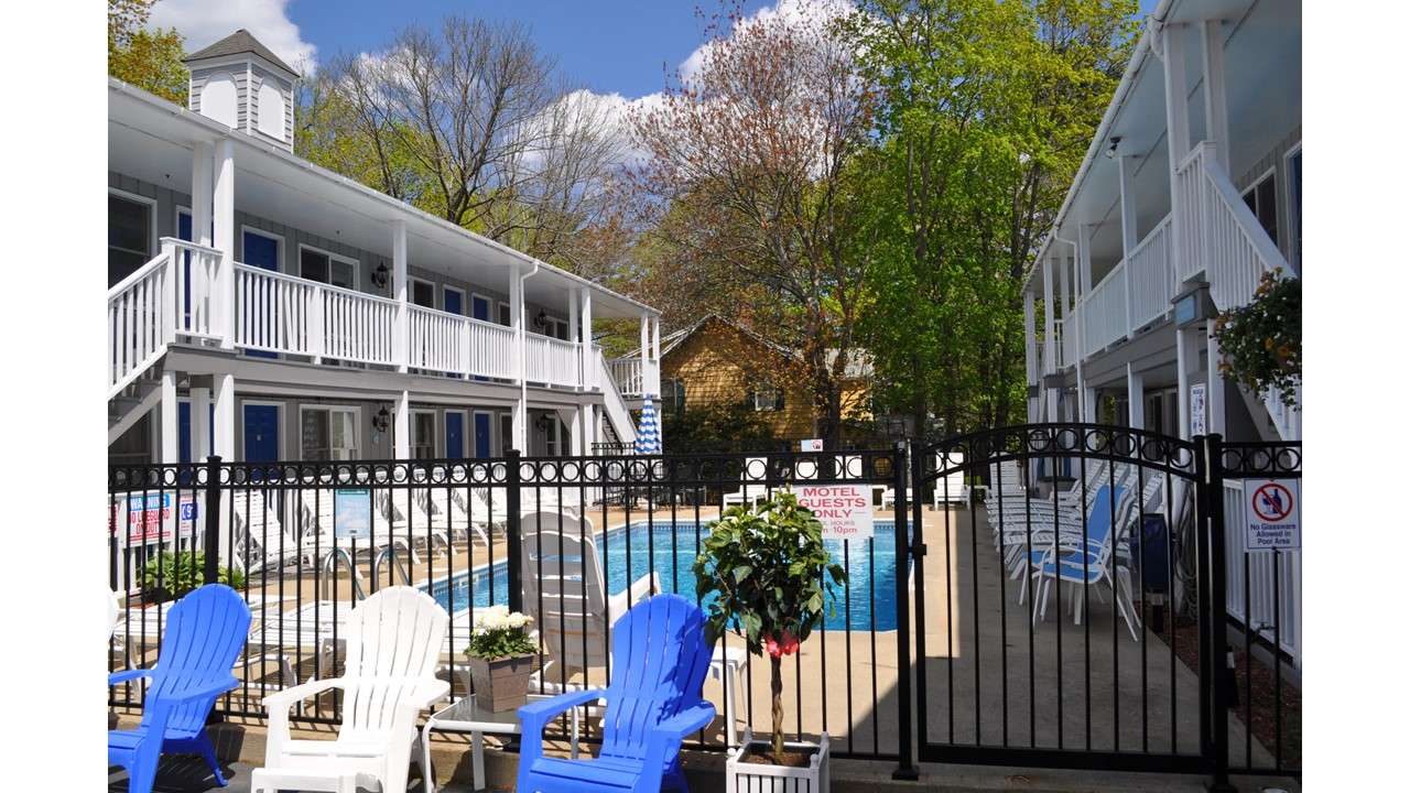 motel chairs fence and pool