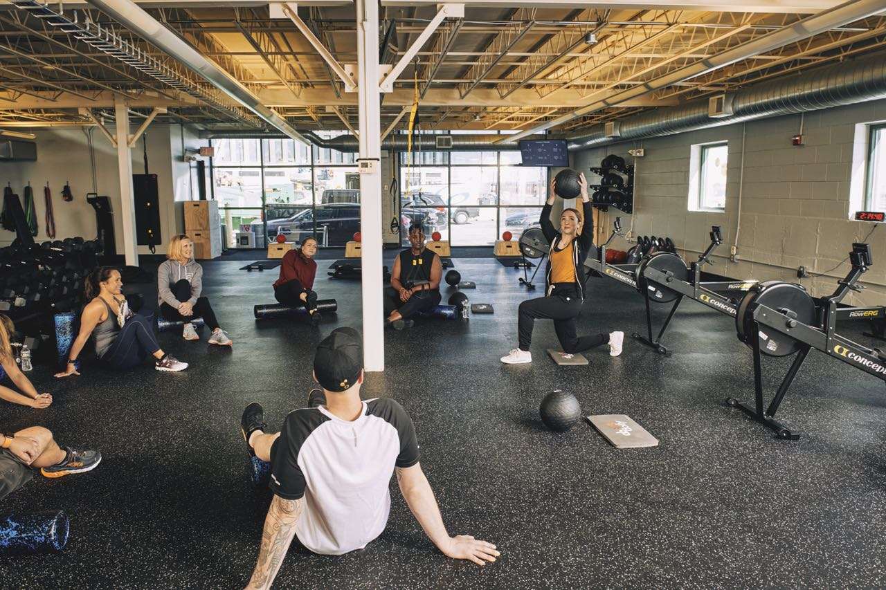 people on floor at gym