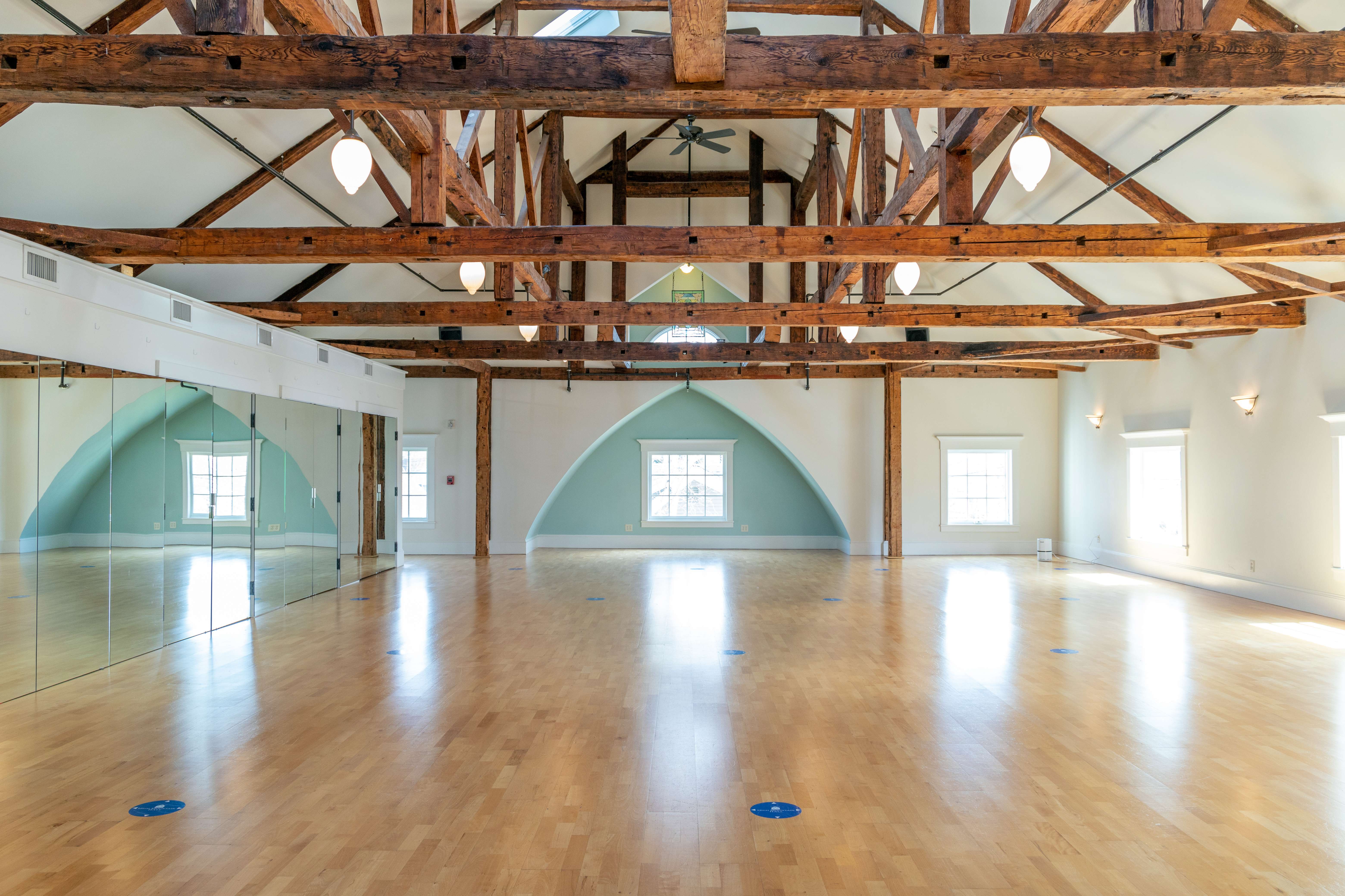 hall with wood floor and beams