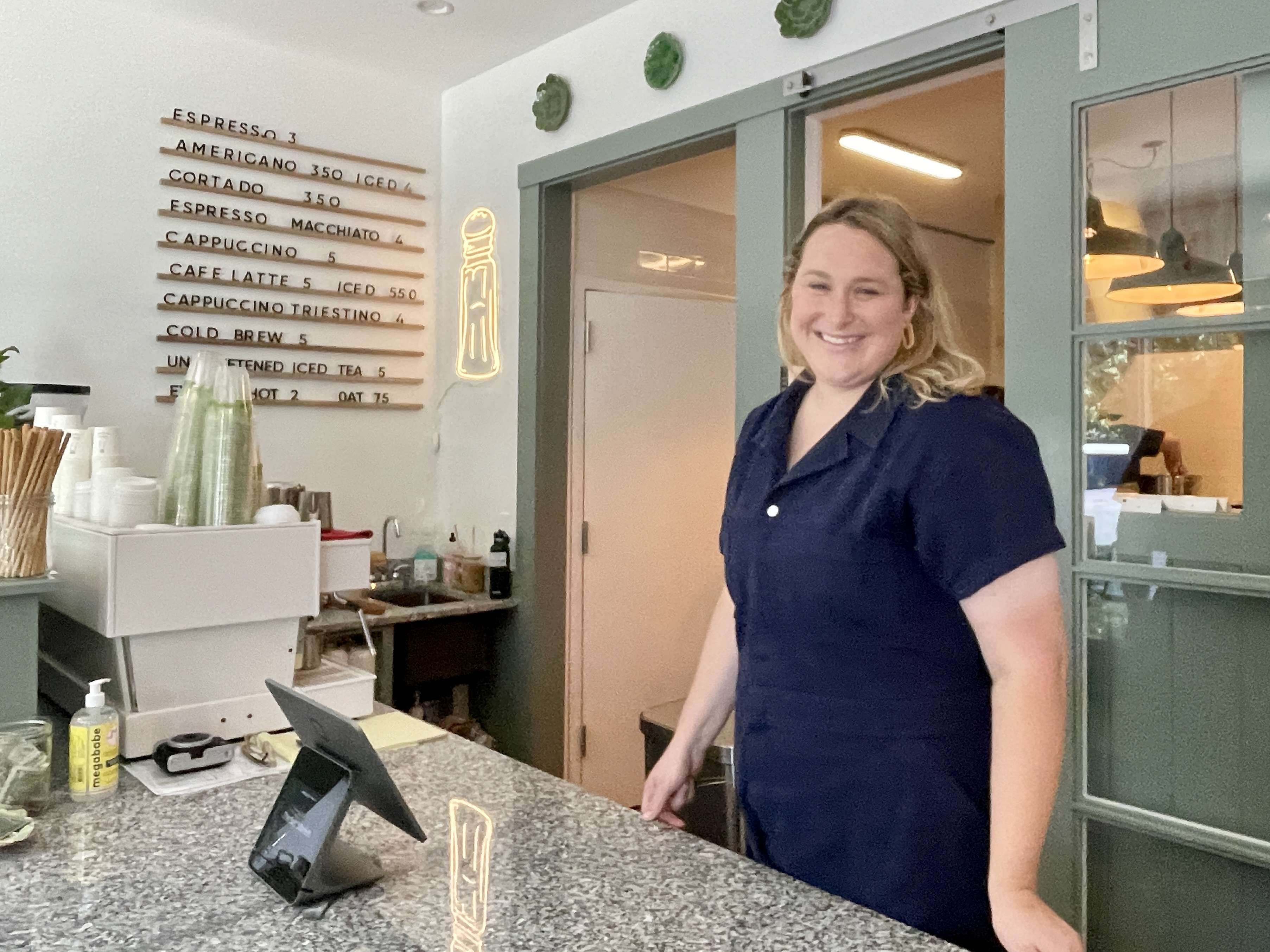 person smiling at counter