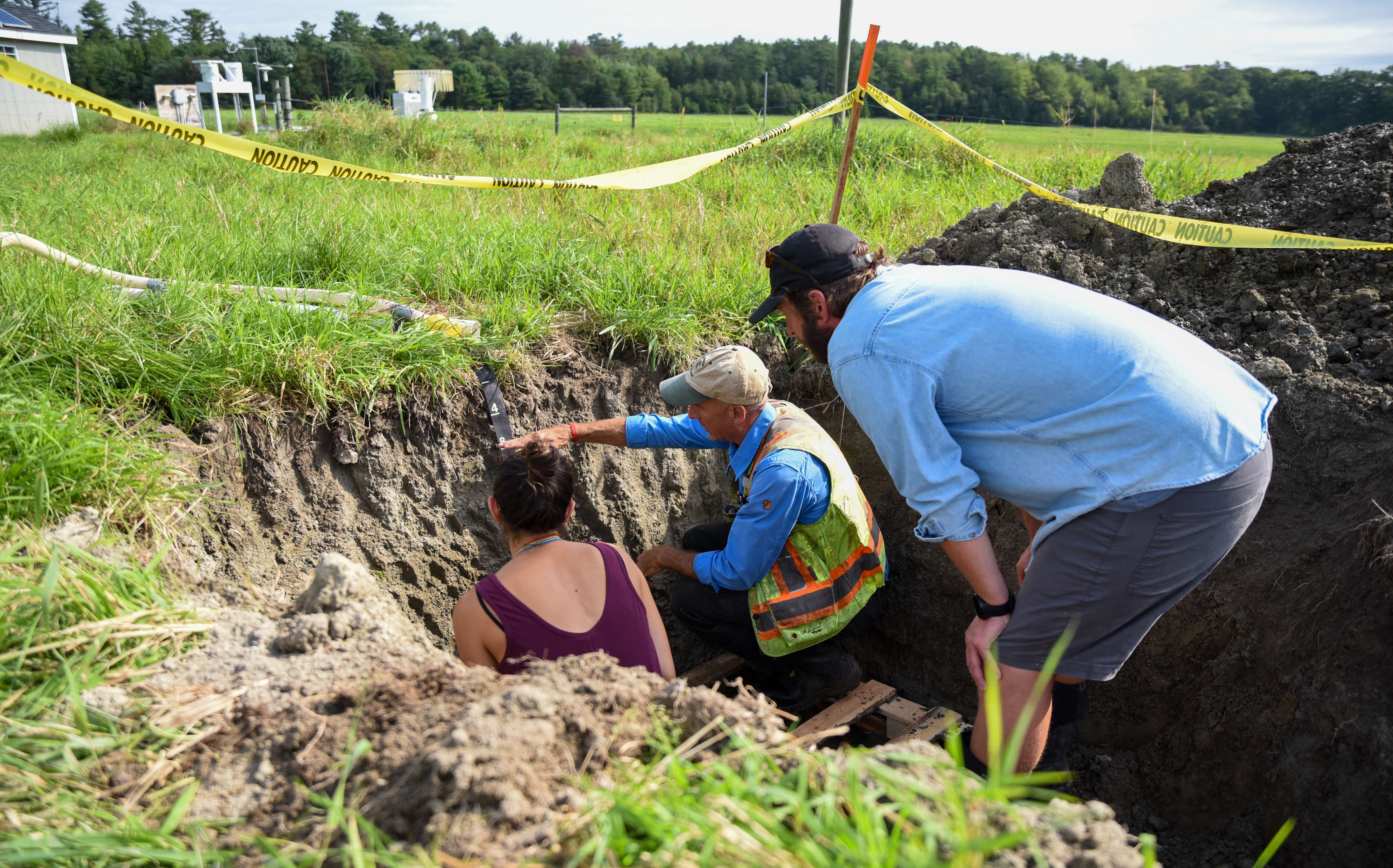 3 people in a ditch