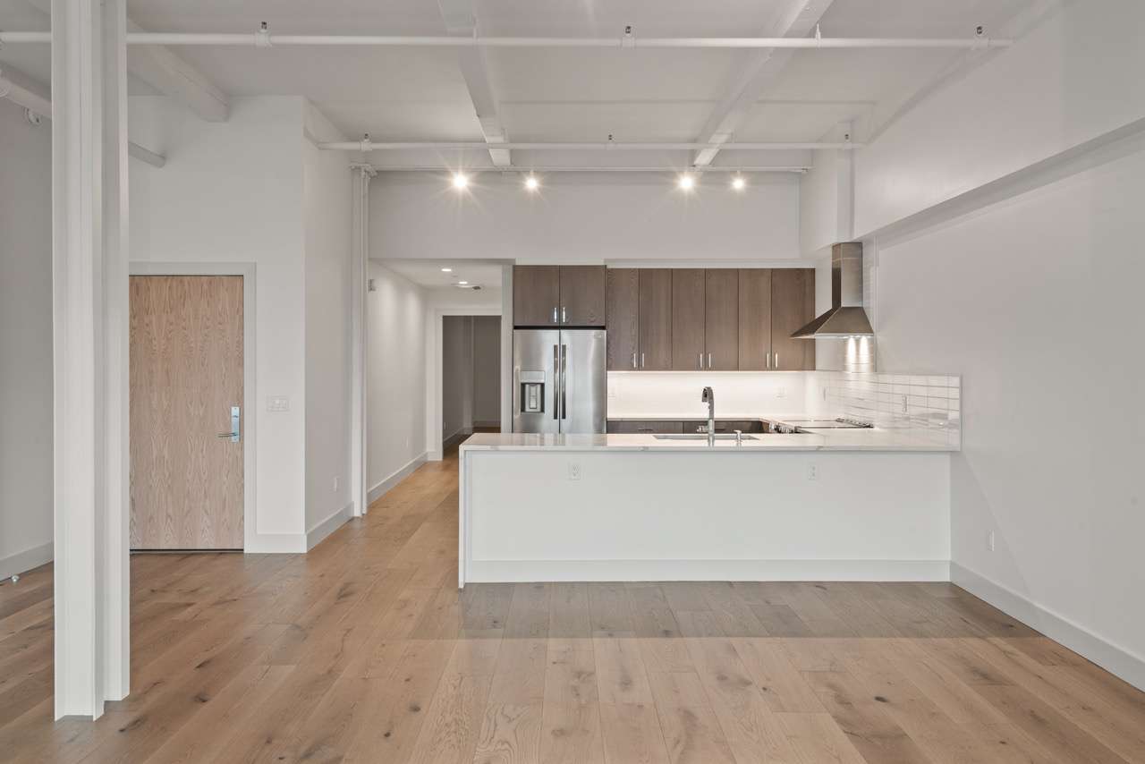 empty apartment with kitchen