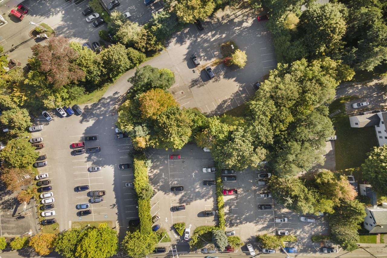 aerial of parking lot with cars