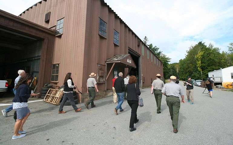 people walking and brown building