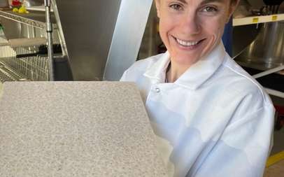 Person holding tempeh cake
