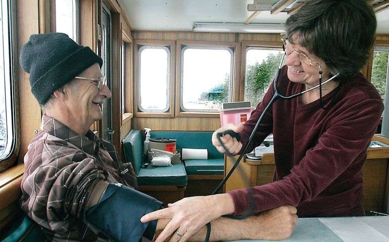 2 people with medical equpment