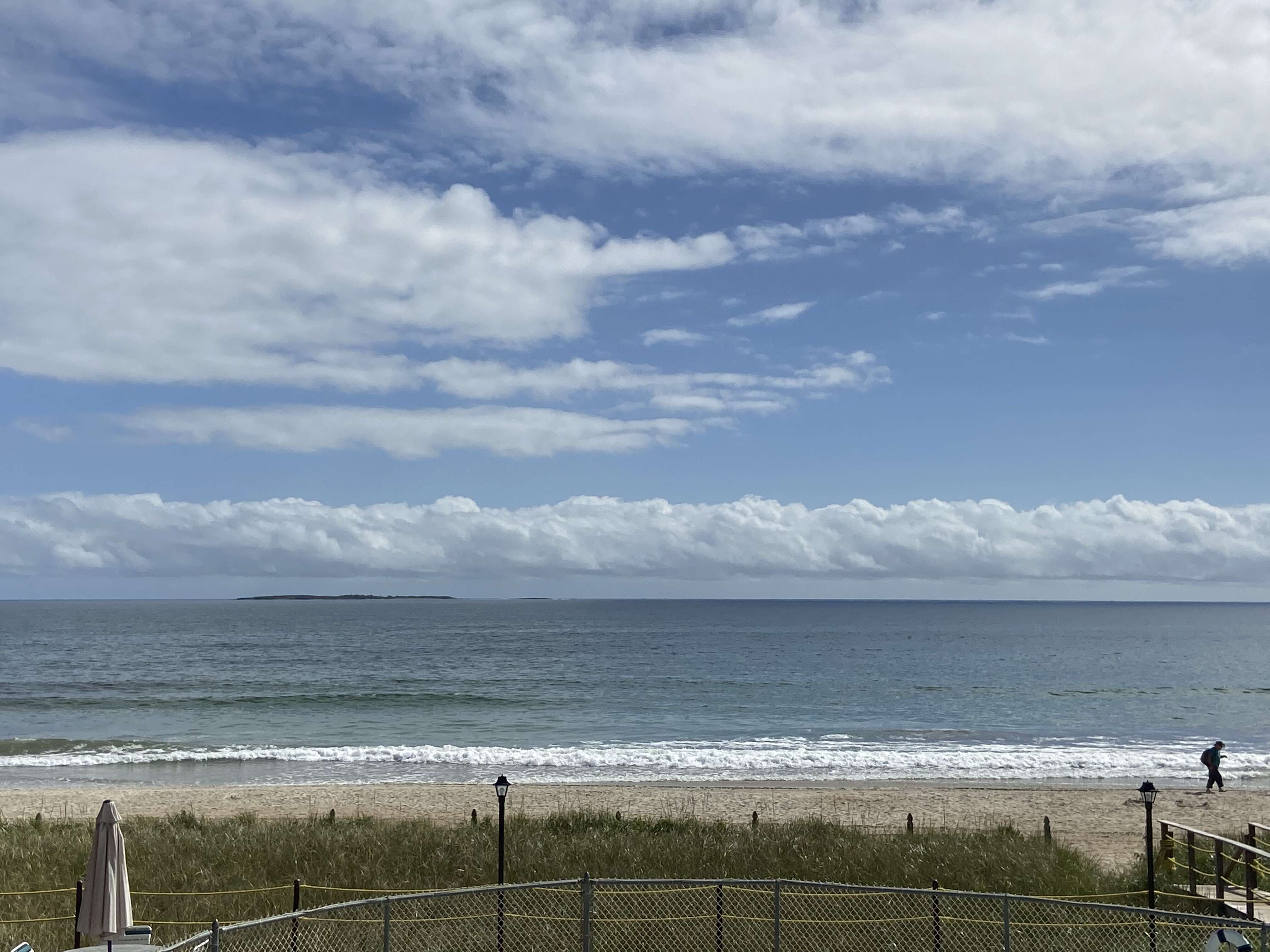 sky ocean beach clouds