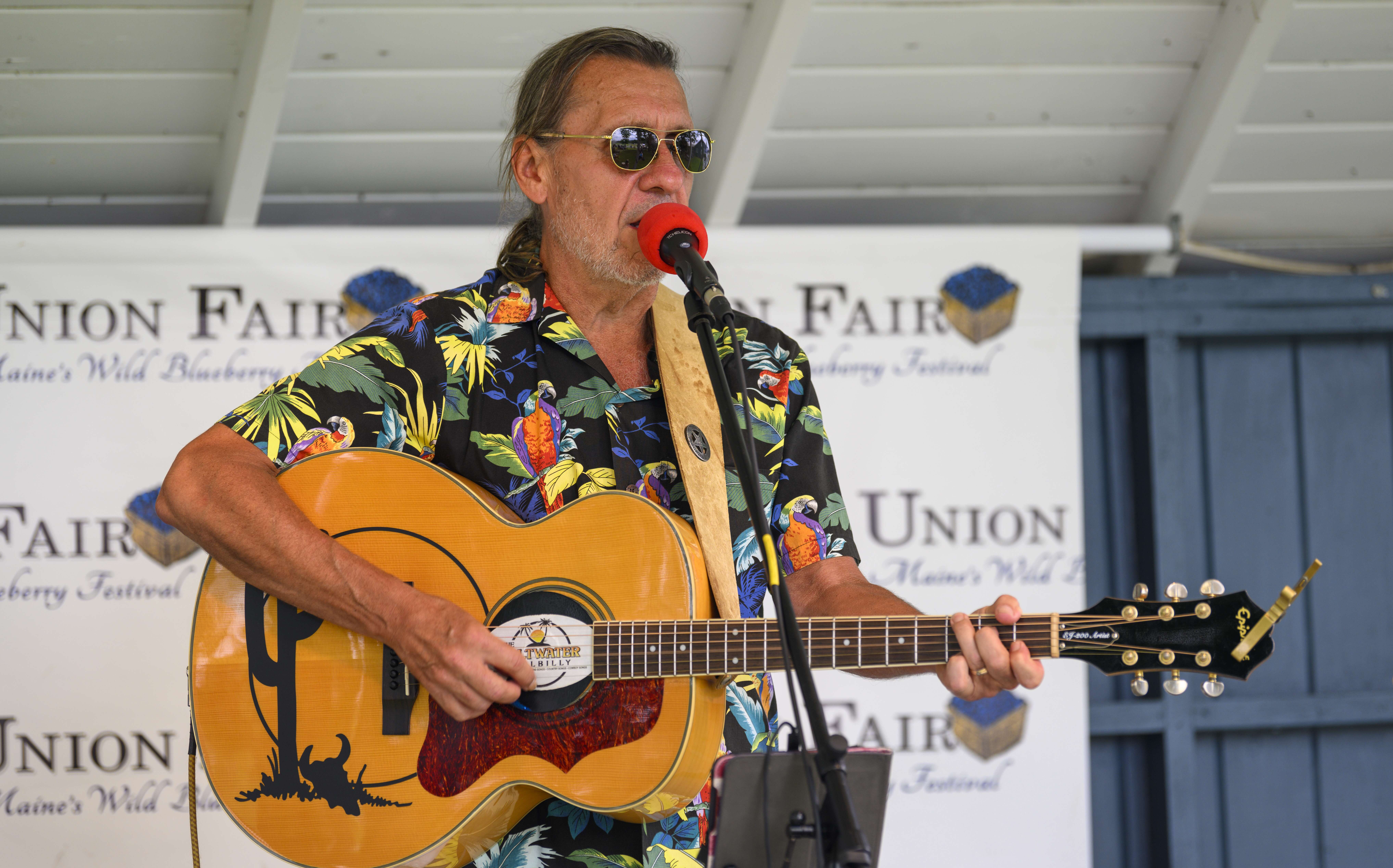 Man playing guitar and singing