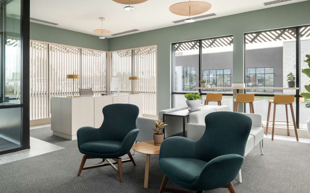 room with seats windows rug