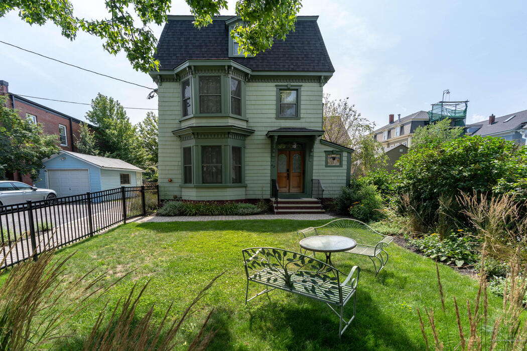 green-sided building and yard