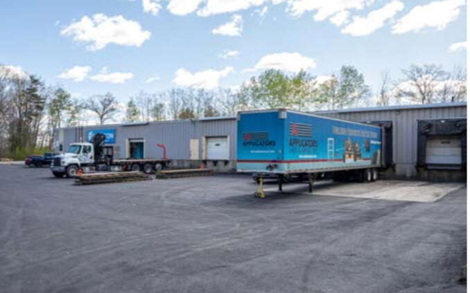 building with big doors and shipping container