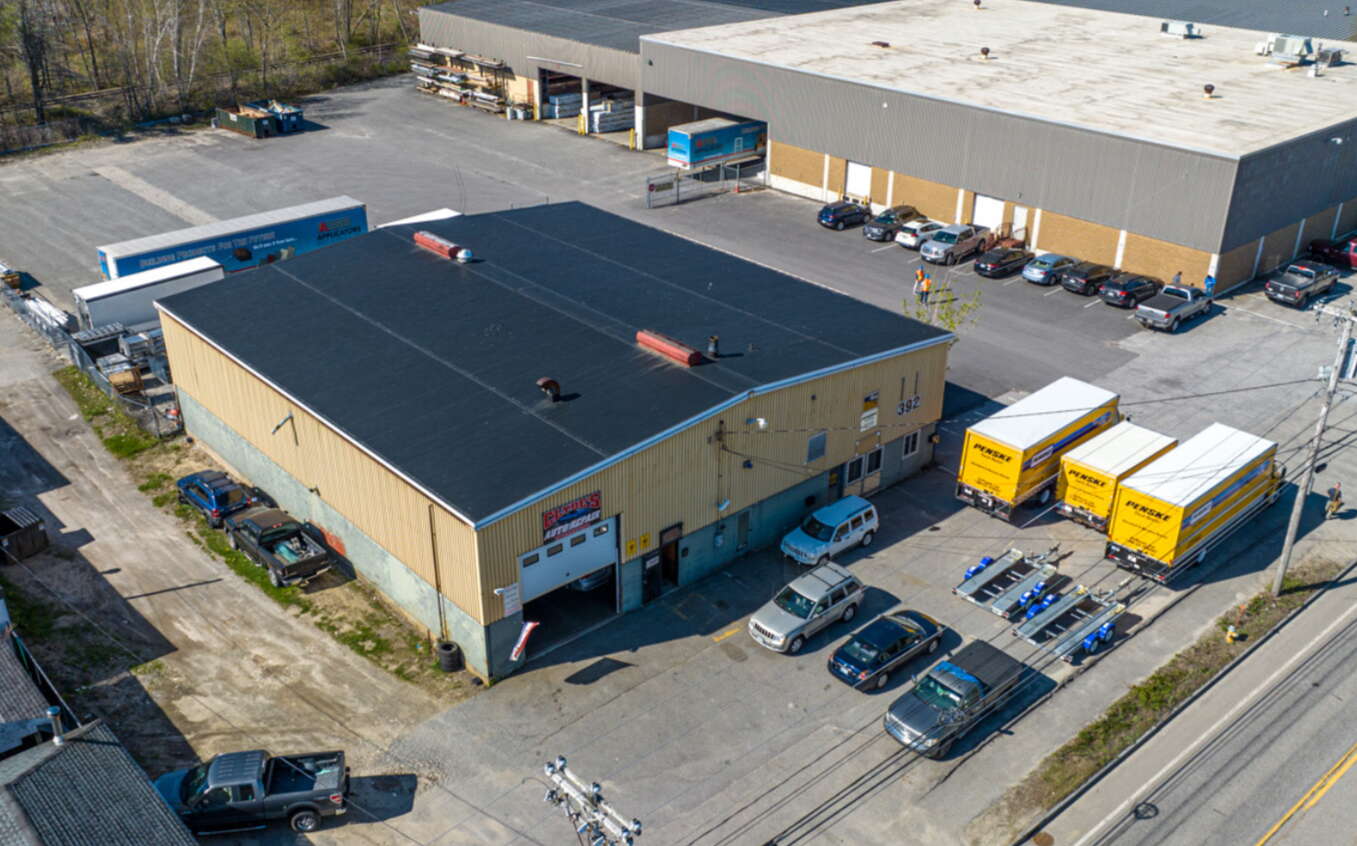 aerial of big buildings, pavement and vehicles