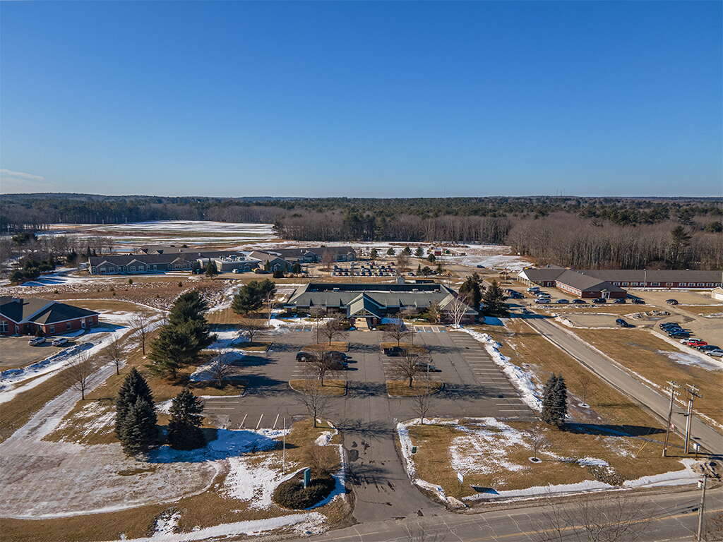 aerial of buldngs parking lawns