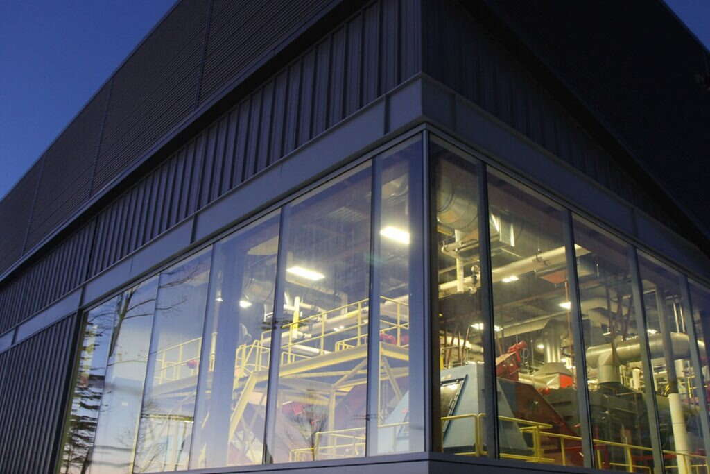 steel building with big windows and lights