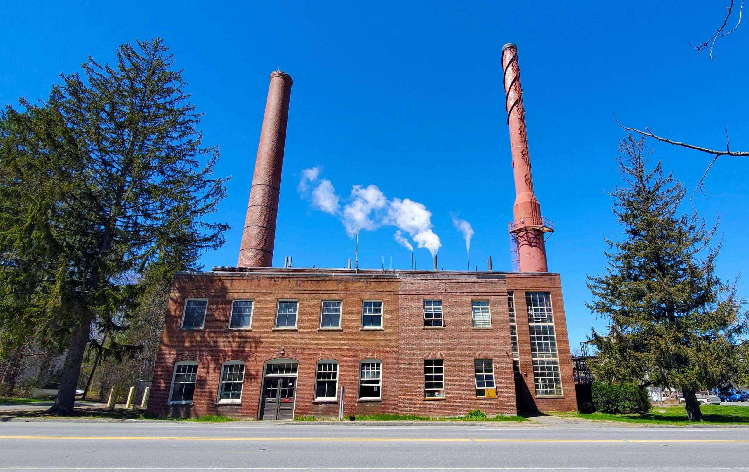 old brick building with two chimneys
