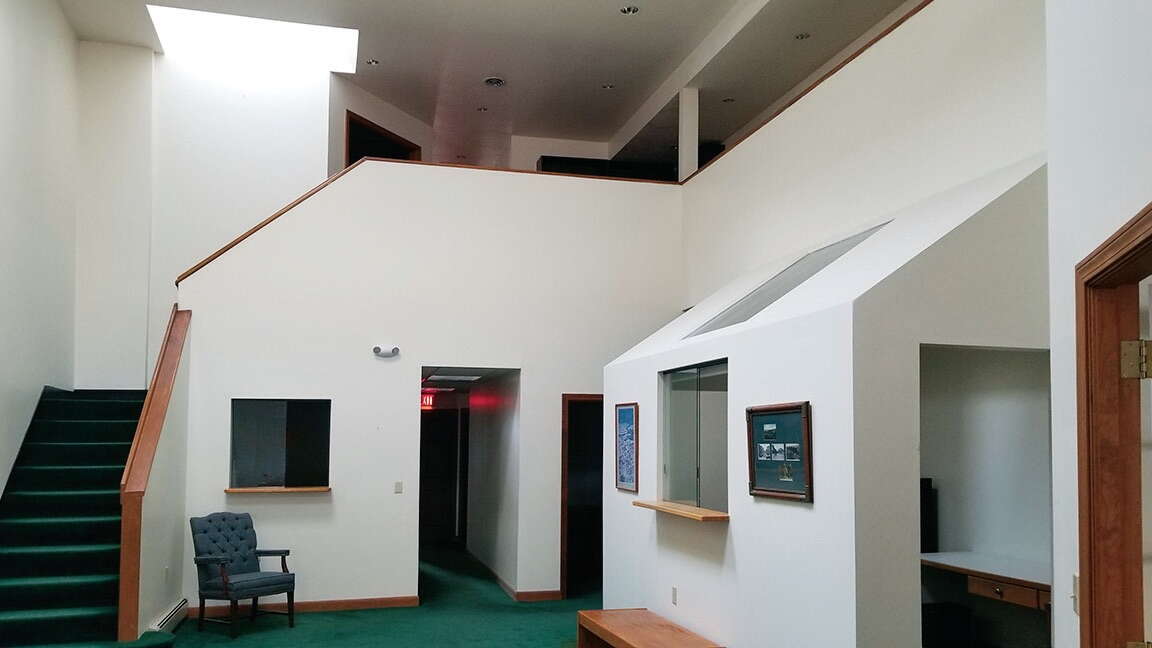 lobby with white walls and doorways