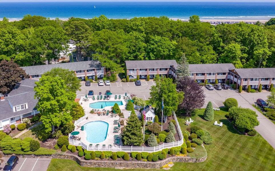 aerial of buidlings, lawns and swimming pool