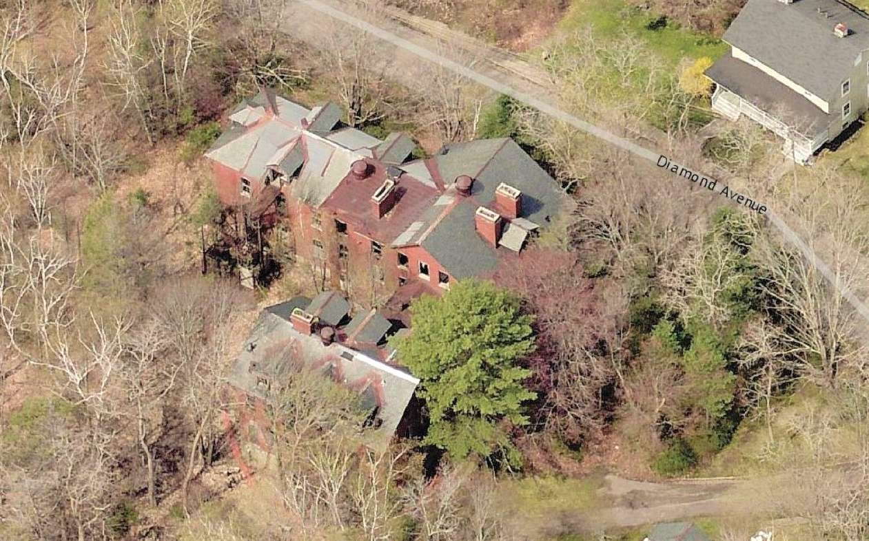 aerial of old building and scrub