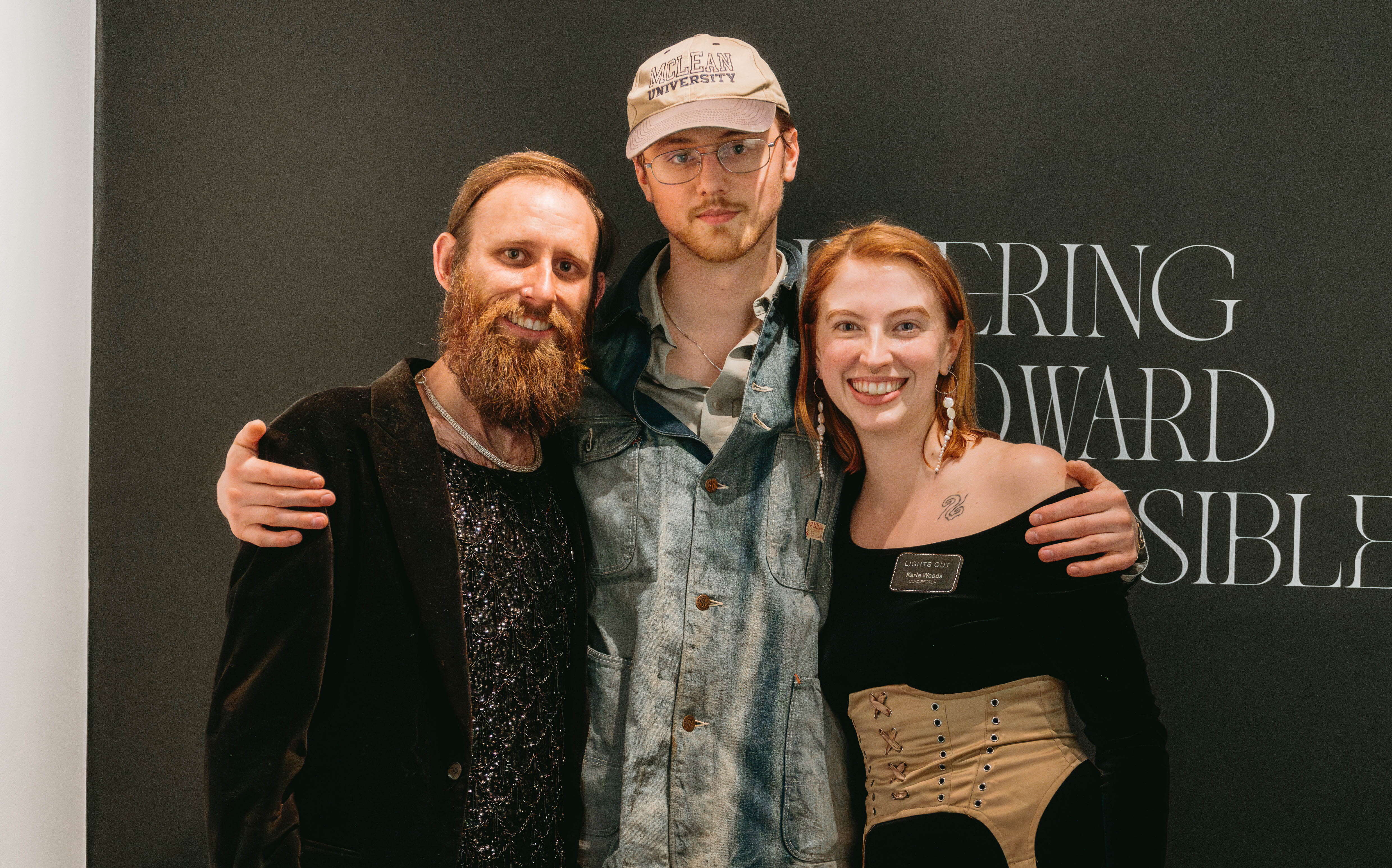 3 people standing and hugging