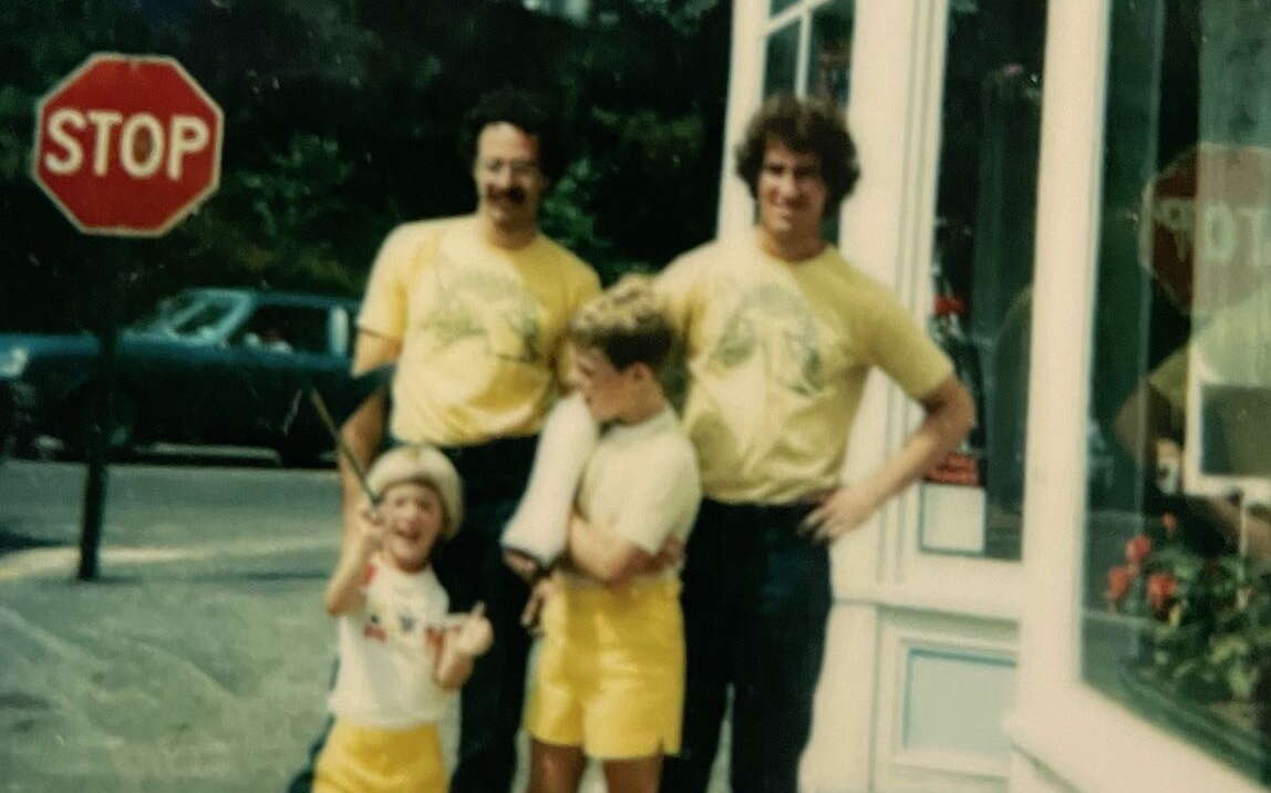 blurry photo of 4 people outside of shop