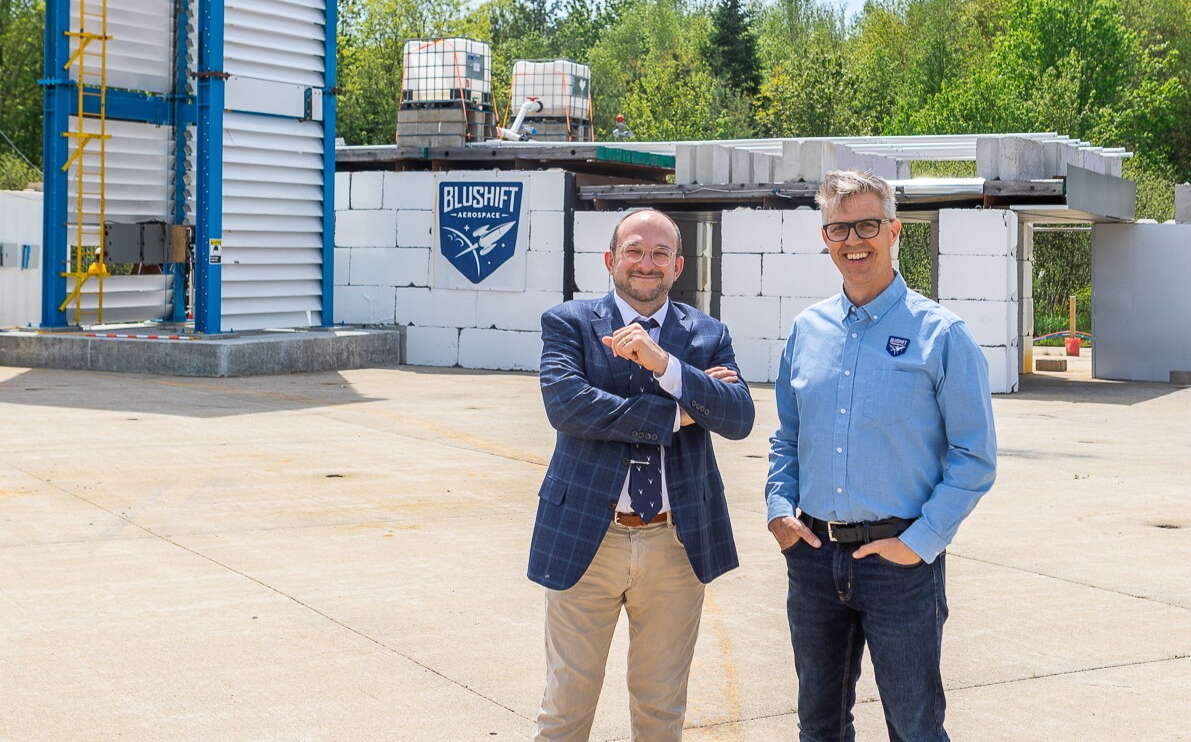 Sascha Deri of bluShift stands with the new board chair at Brunswick Landing.