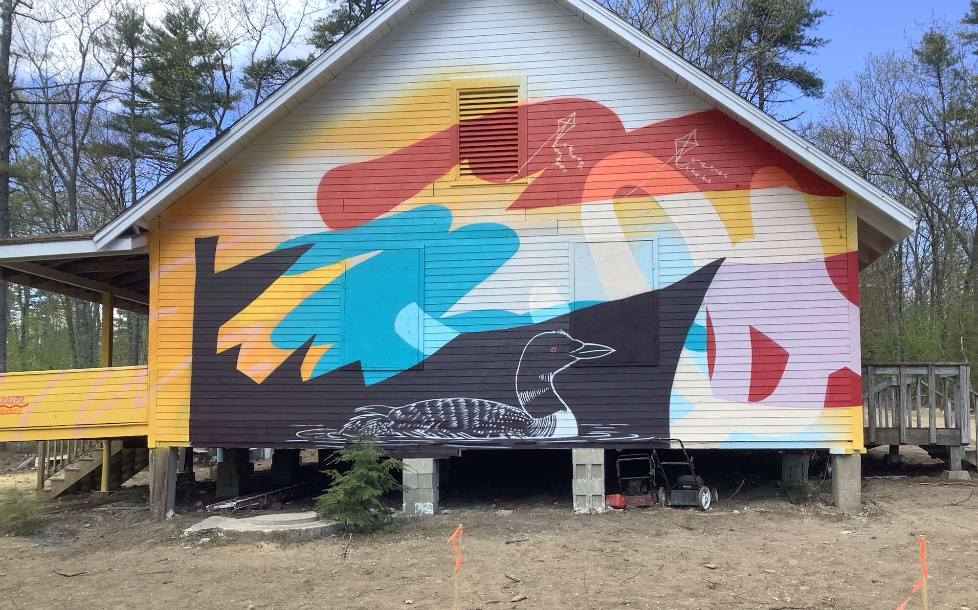 A cabin at The Kita Center is painted with colorful images