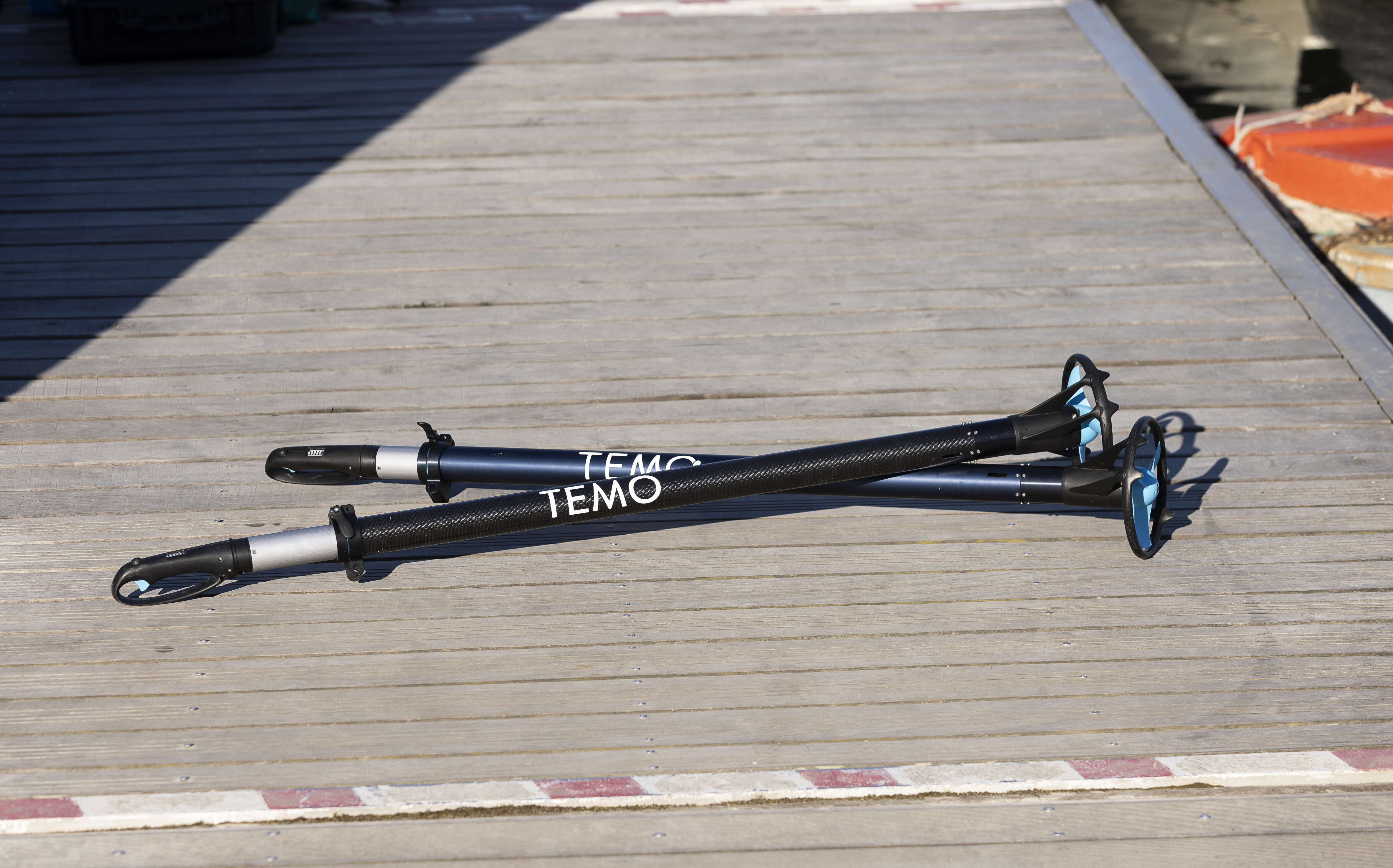 Two motors lie on a dock.