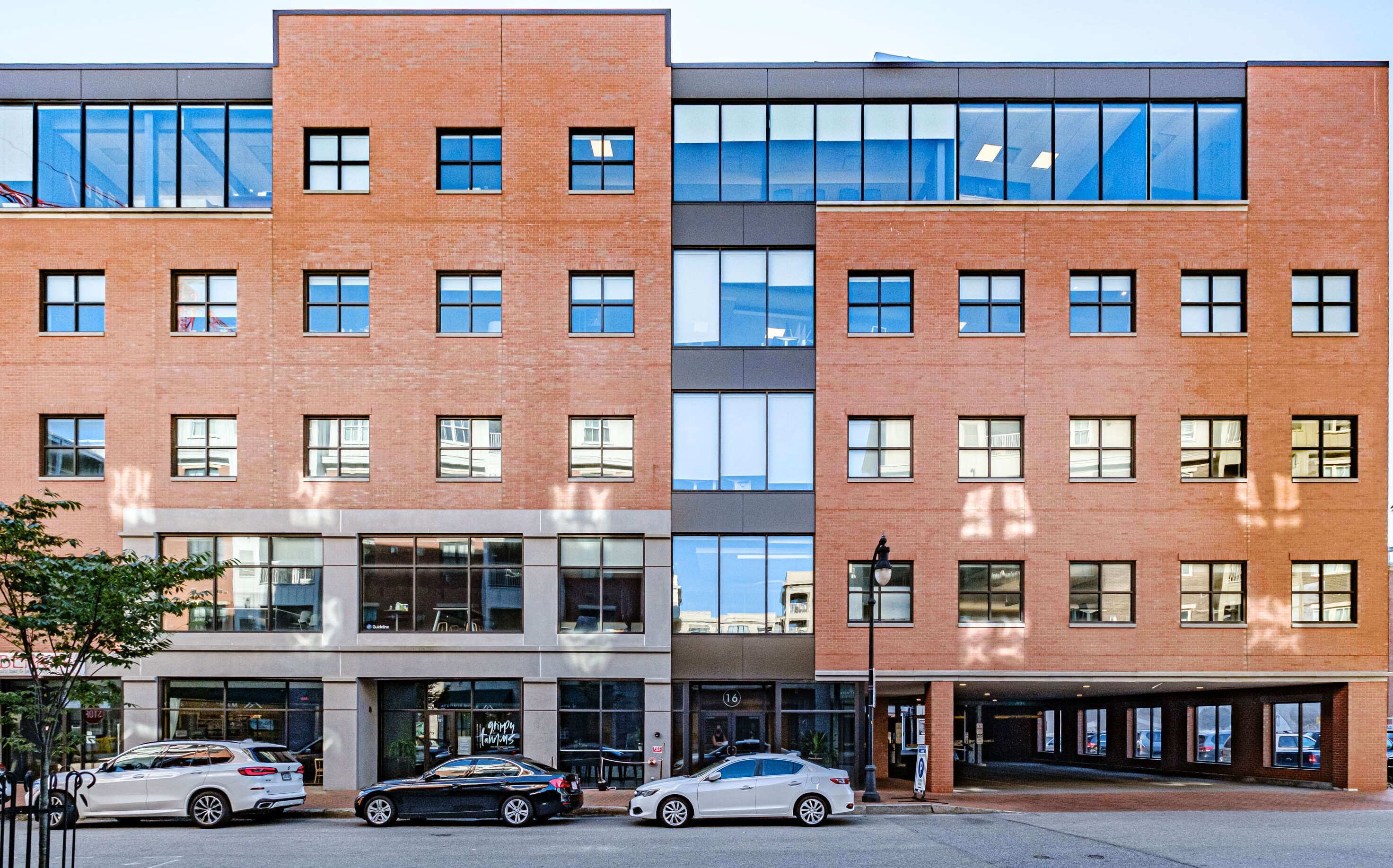 A building includes brickwork and granite and windows.