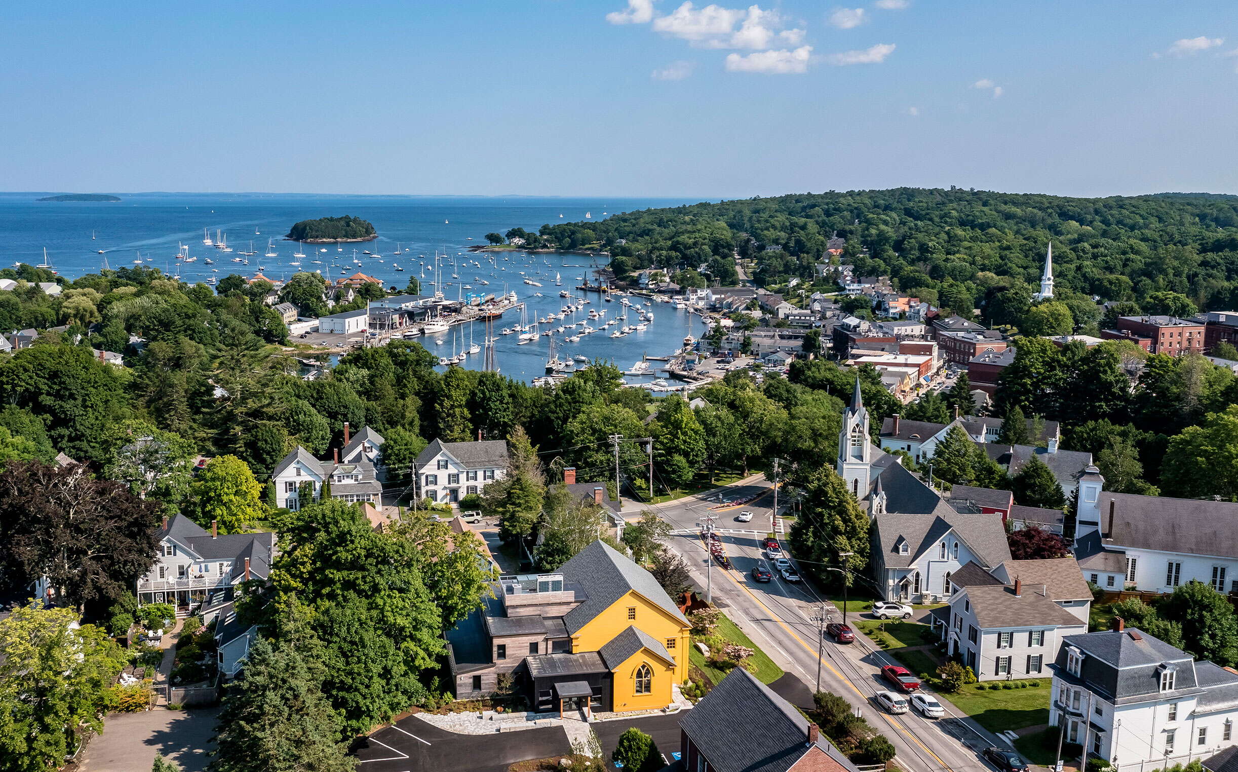 An aerial view of buldings and a harbor.