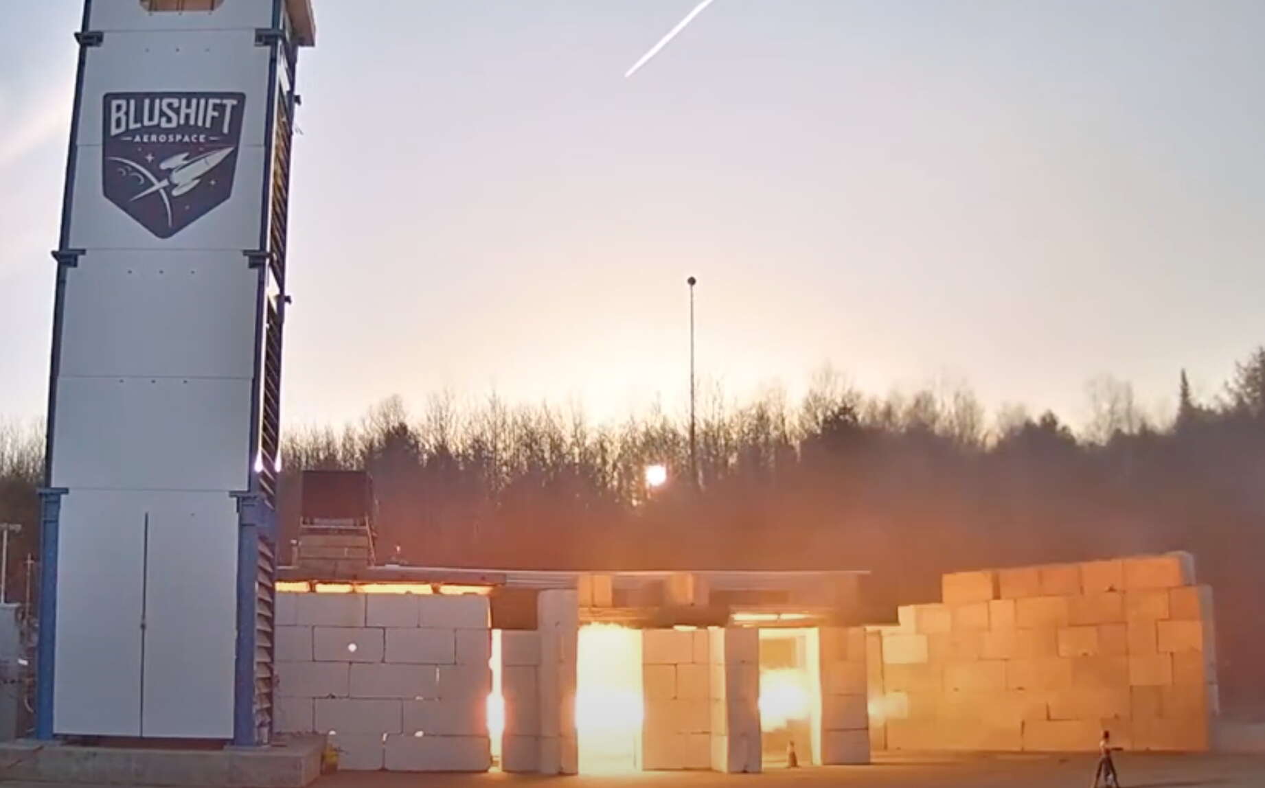 A fiery scene is seen from the outside.