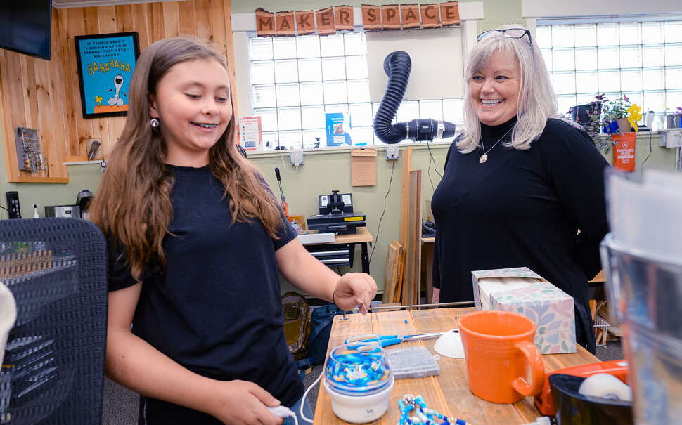 Two people are in a workshop.