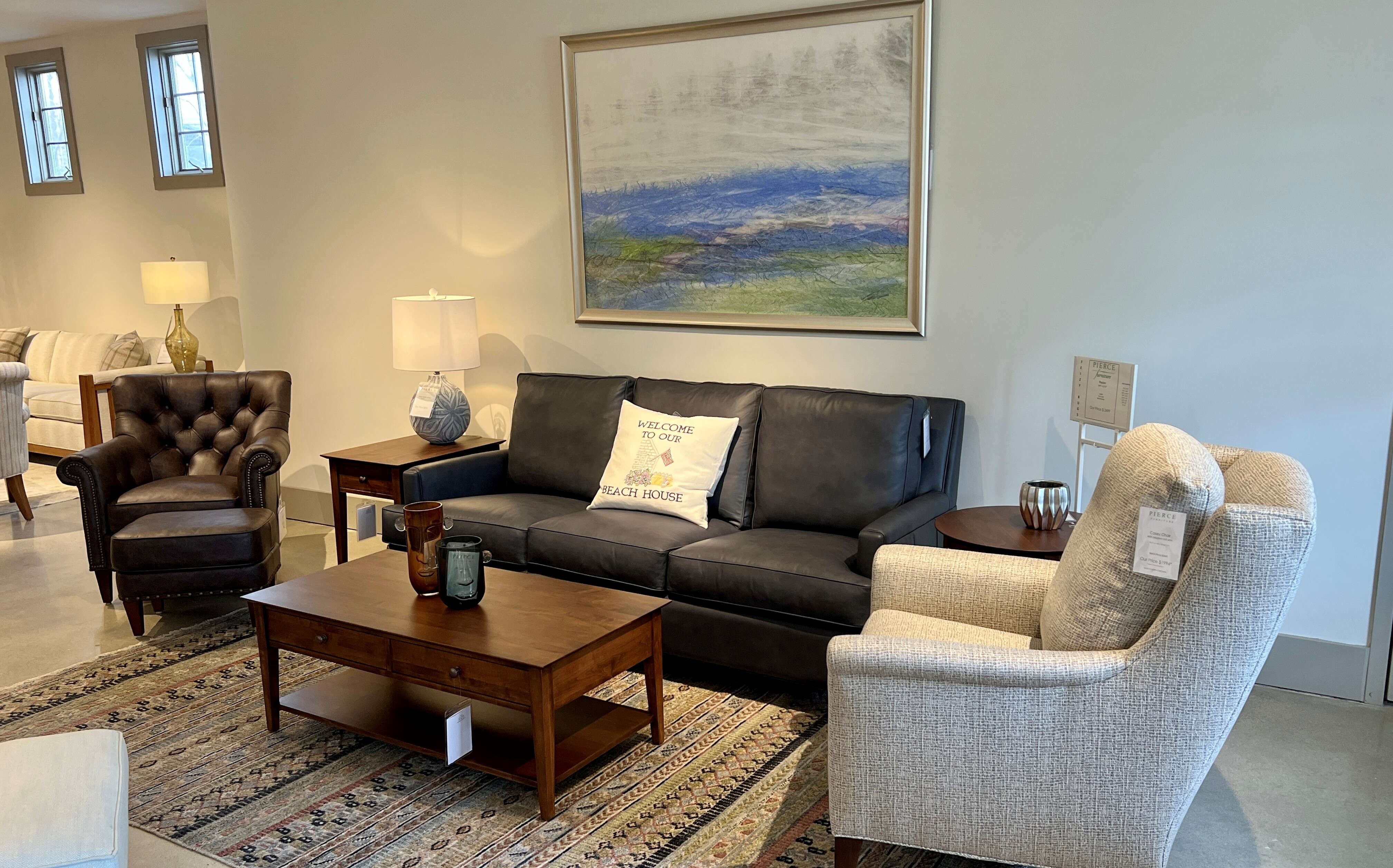 A room interior has furniture and a rug.