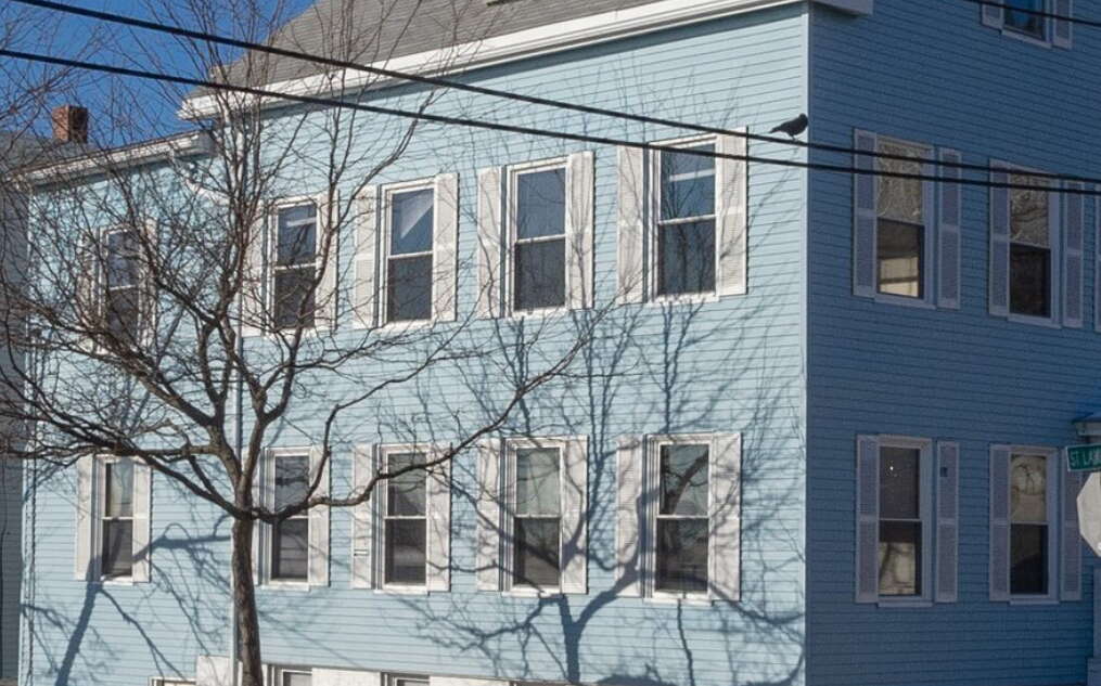 A building has sky-blue siding.